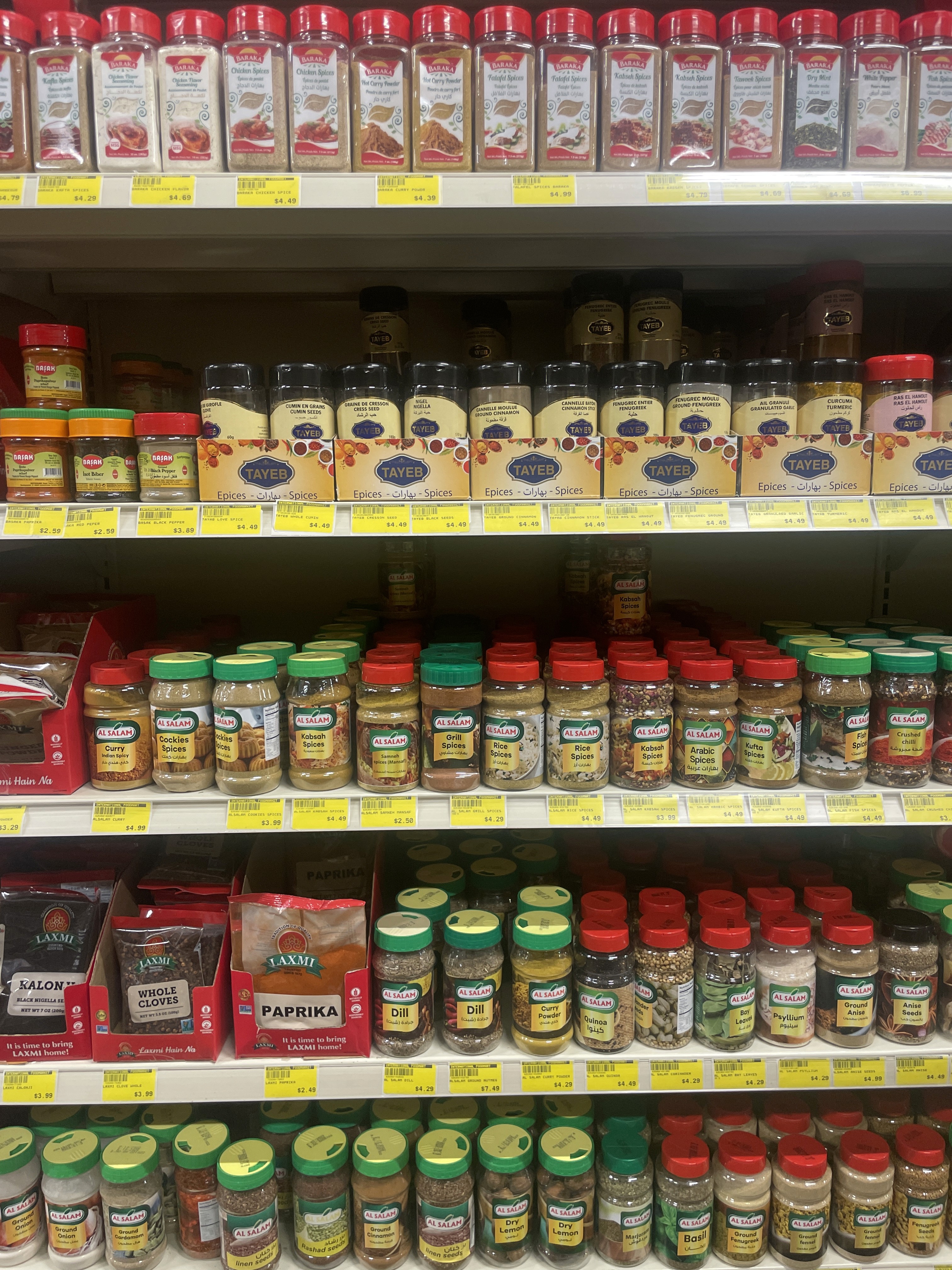 Bottled and packaged spices, including turmeric and cumin, at International Food Market Orlando.