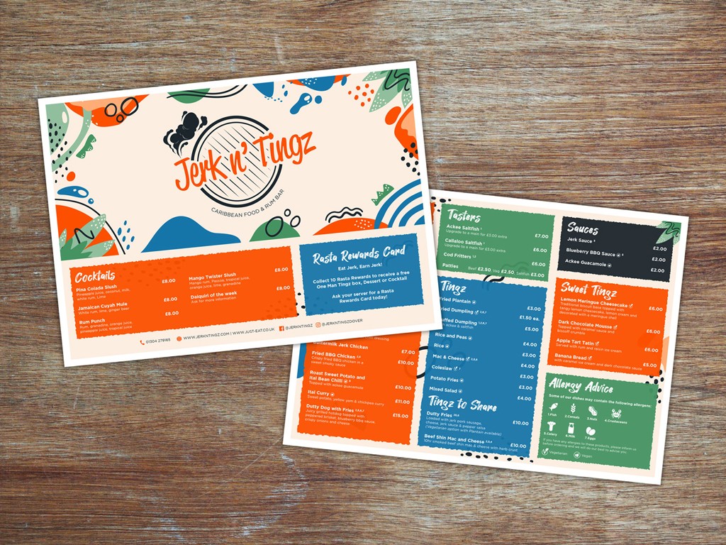 Branded menus for a Jamaican restaurant laid out on a table