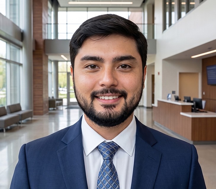 a man in a suit posing for a picture