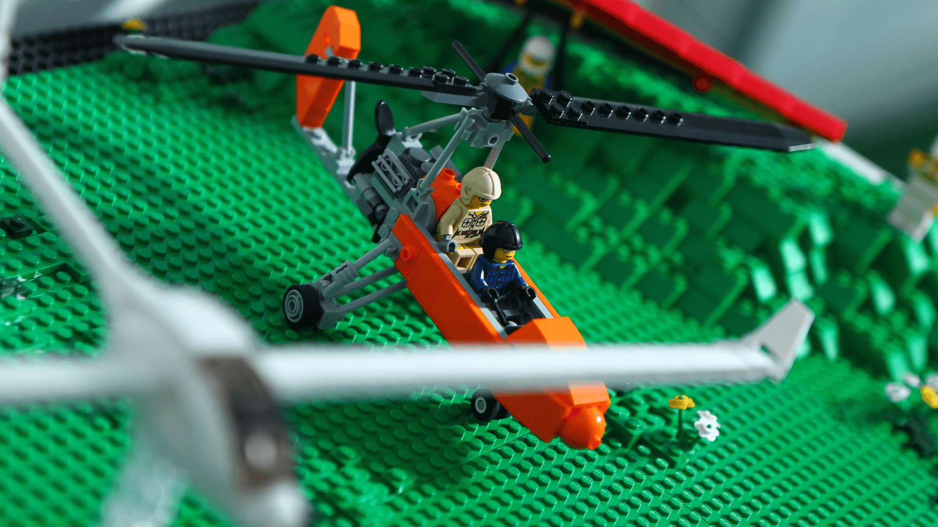 Two LEGO® pilots sit inside the Jet Ranger helicopter.