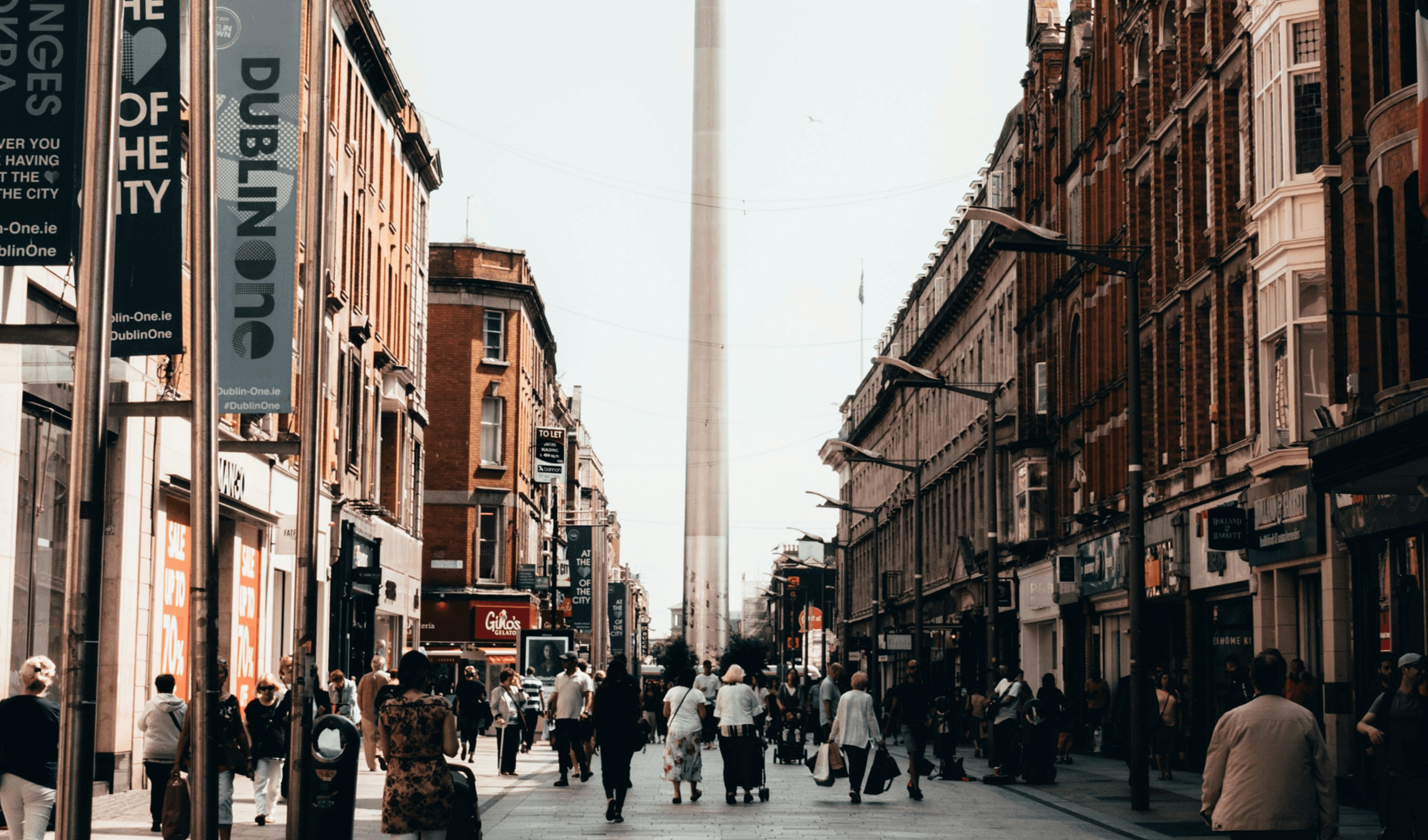 Street scene in central Dublin leading toward the Spire, representing the city’s urban identity.