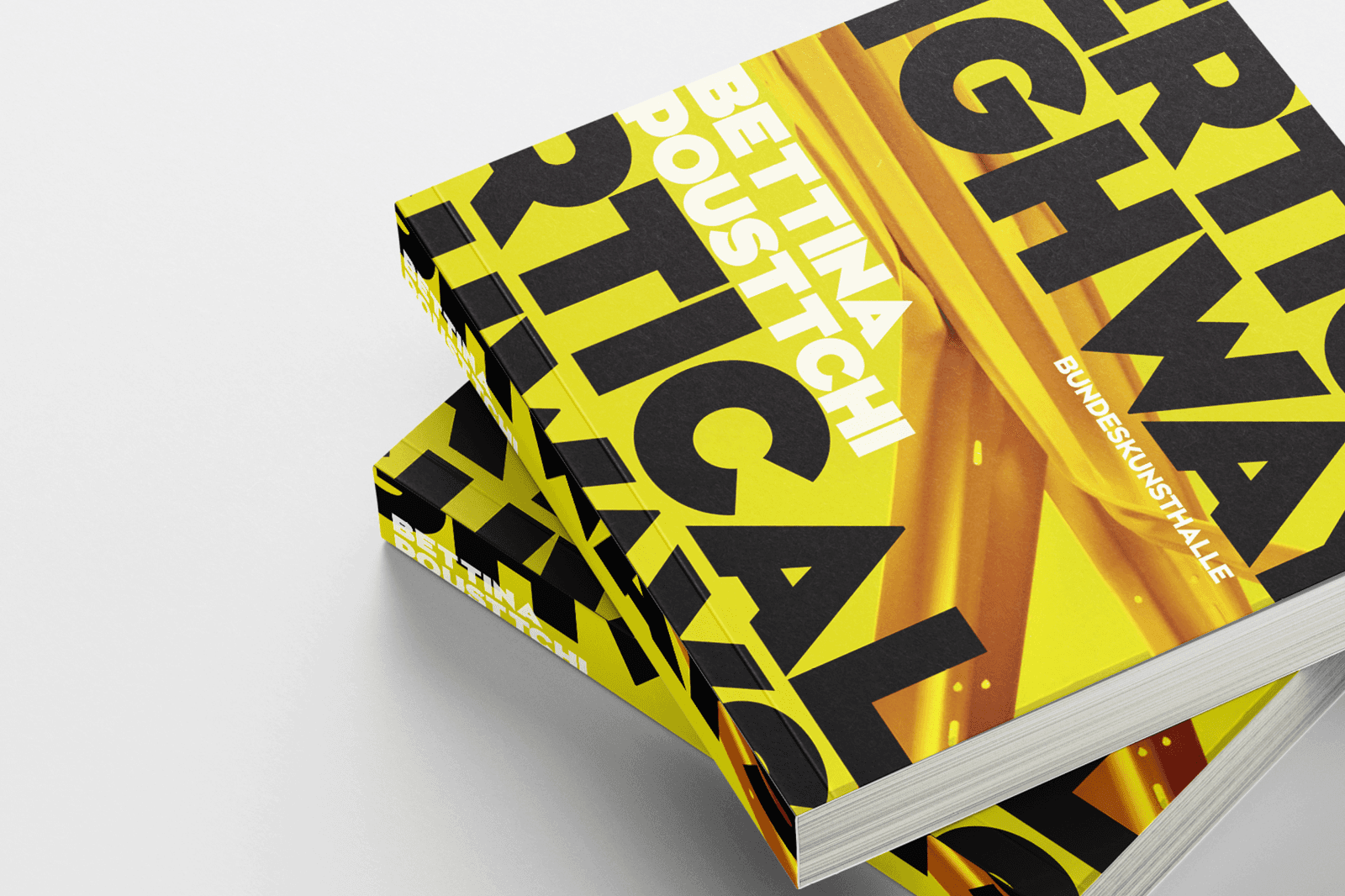 Close-up of stacked books with bold yellow covers featuring the title "Critical Highways" in large black text.