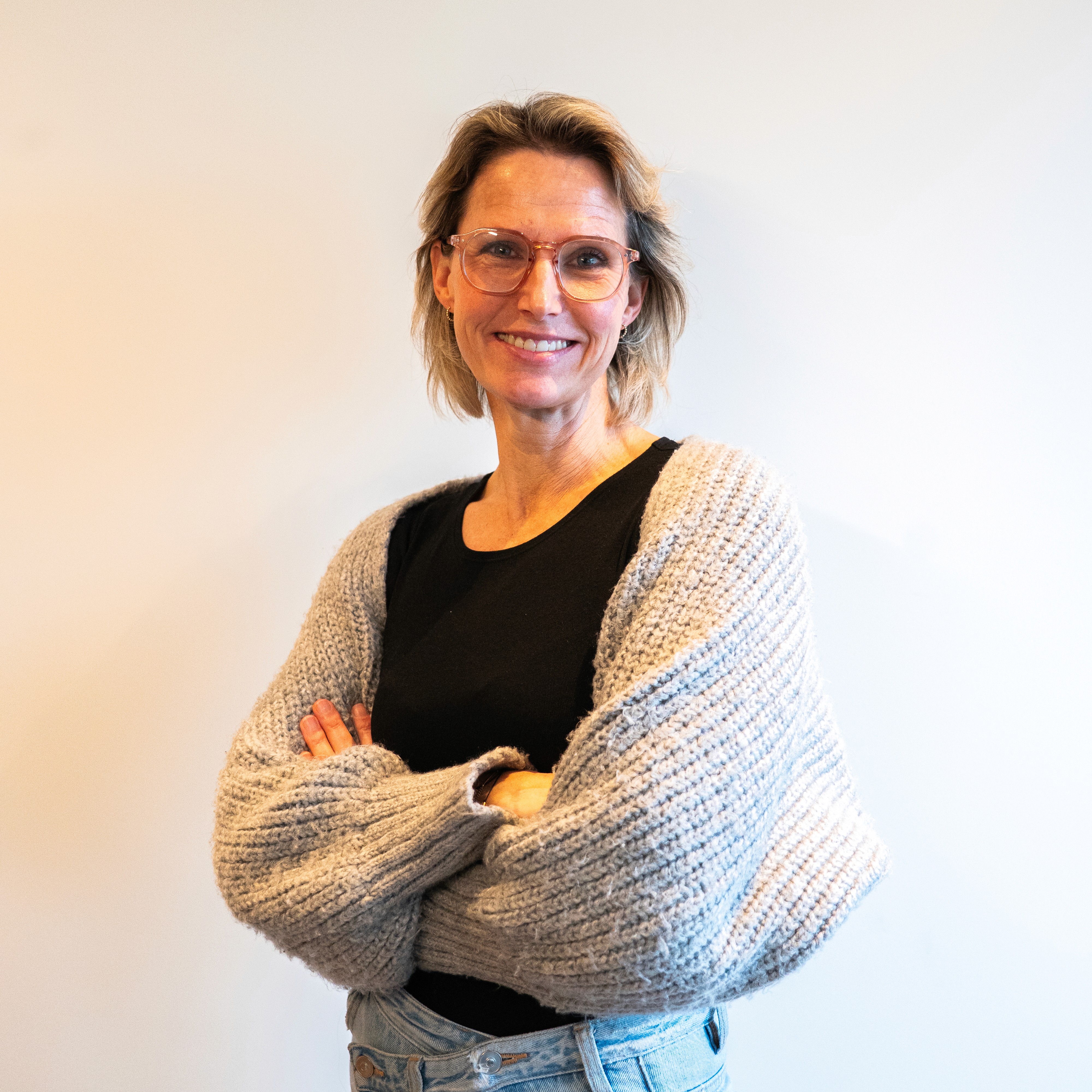 Portrait of a person in dark clothing speaking on a phone
