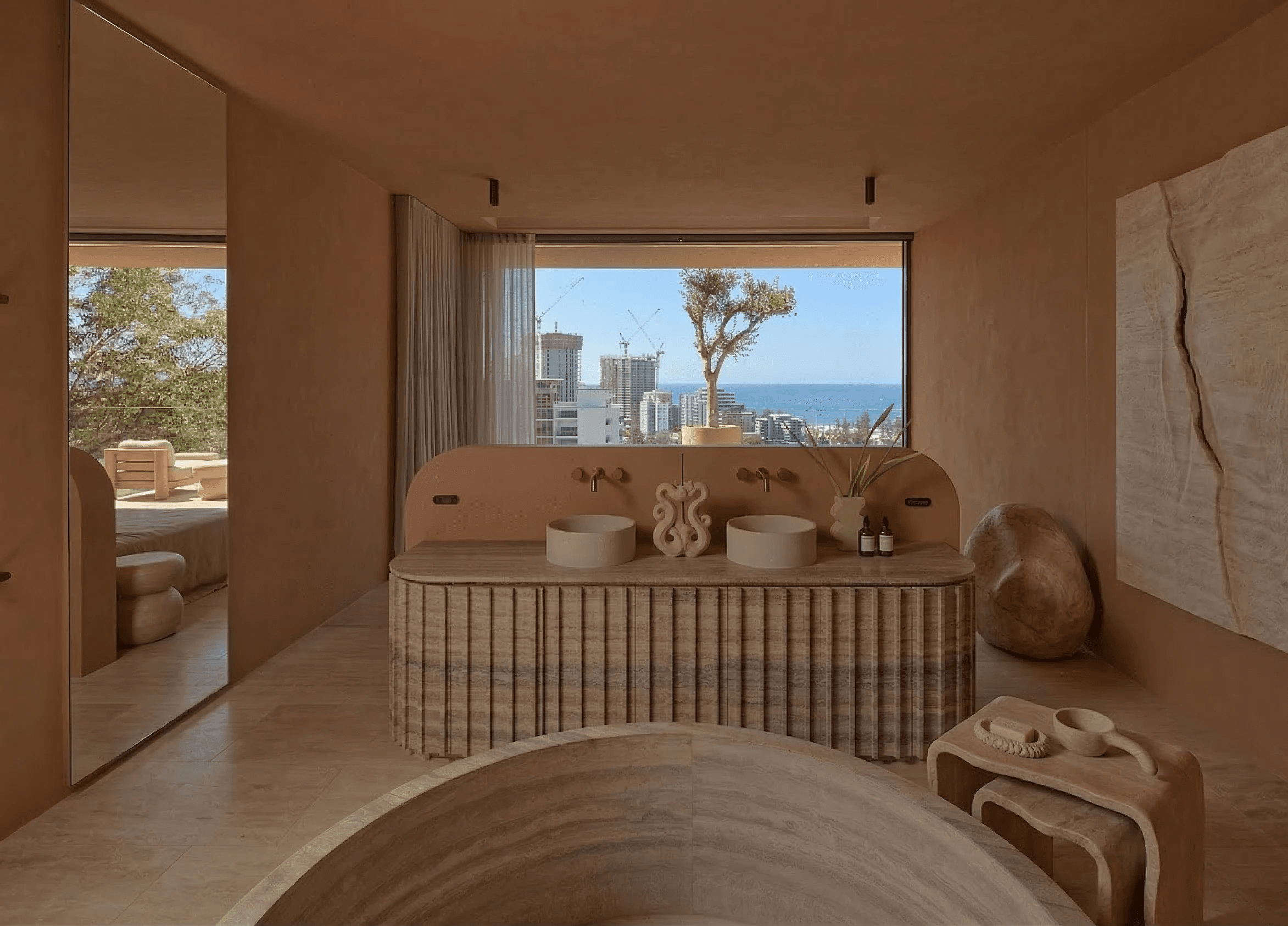Terracotta corridor with geometric arches, diffuse sunlight, and textured stucco surfaces.