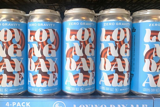 A row of Loving Day Ale beer cans by Zero Gravity brewery.