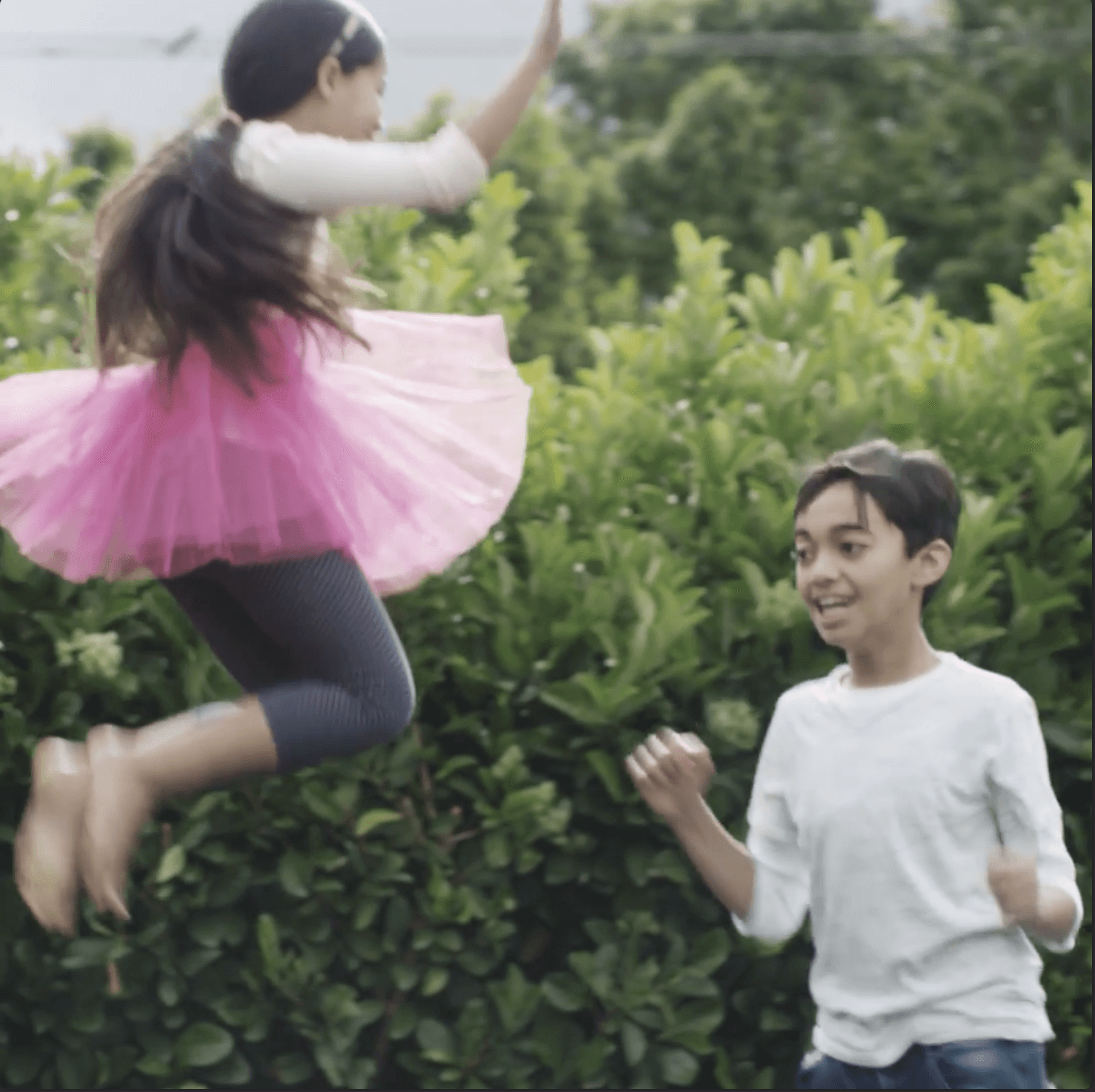 Children playing outdoors, representing Little Joys’ joyful and trust-driven wellness identity