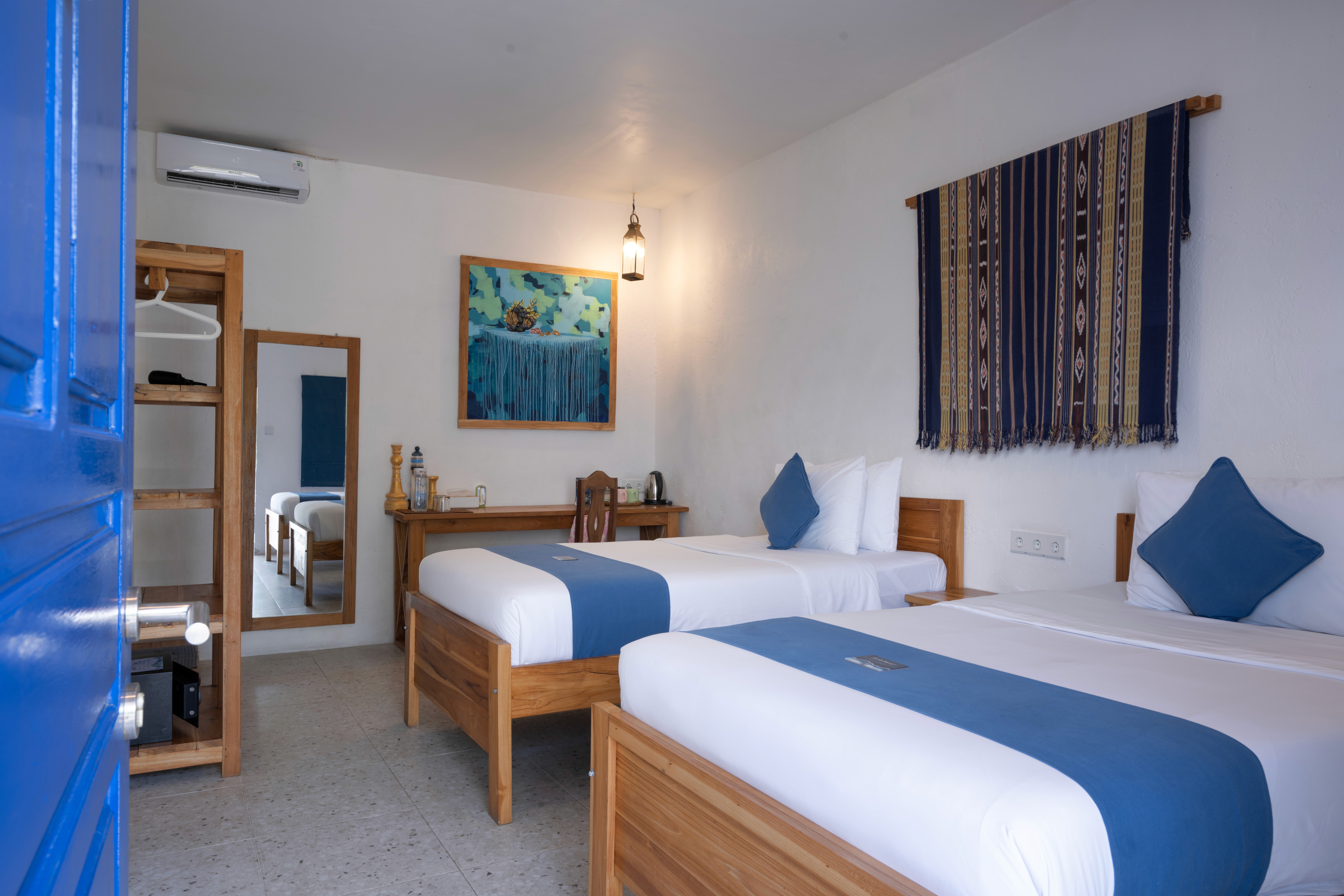a bed room with two beds and a table