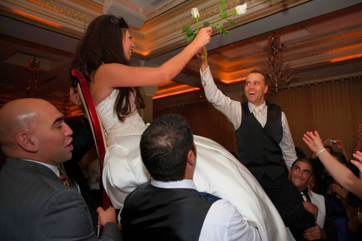 Bride and groom celebrating together at their wedding.