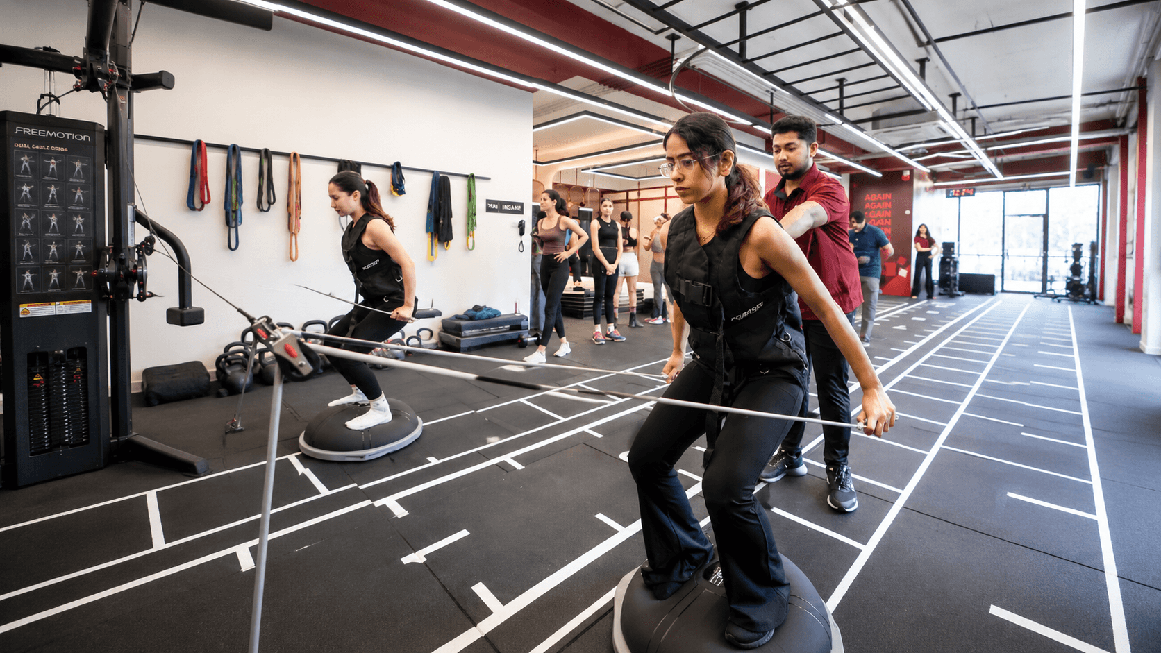 Female athlete improving mobility, balance, and movement control through functional training at Ember & Ice Health.