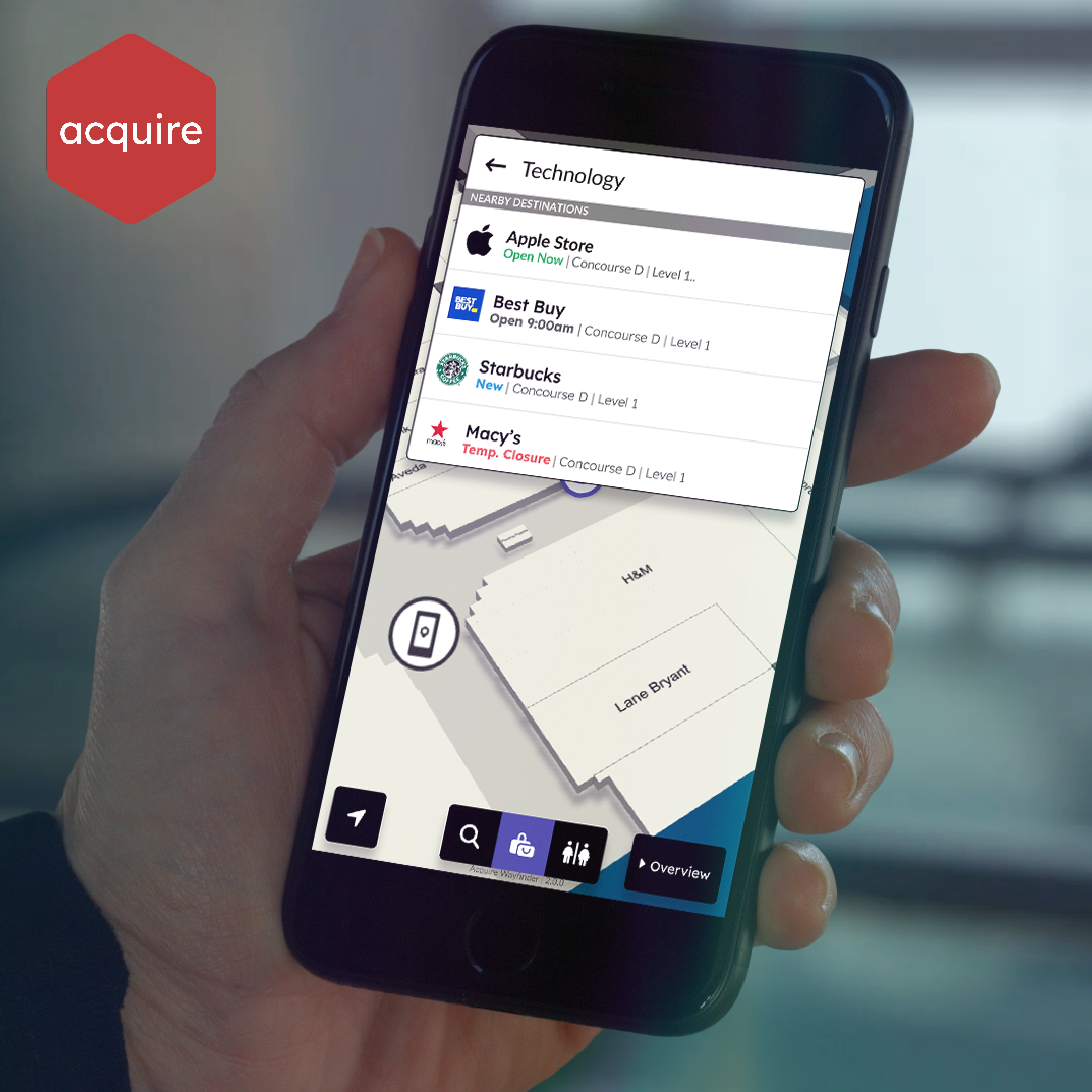 Image of a hand holding a mobile phone with Wayfinder on it