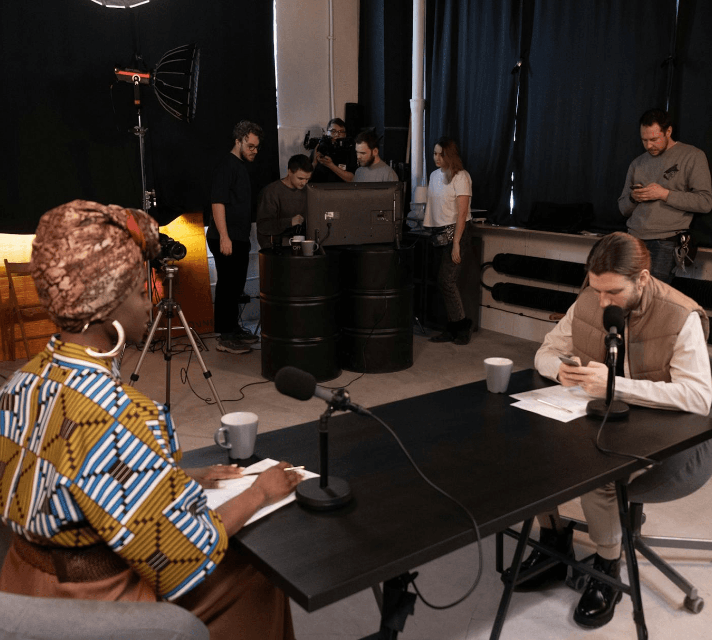 group of people filming and recording a podcast