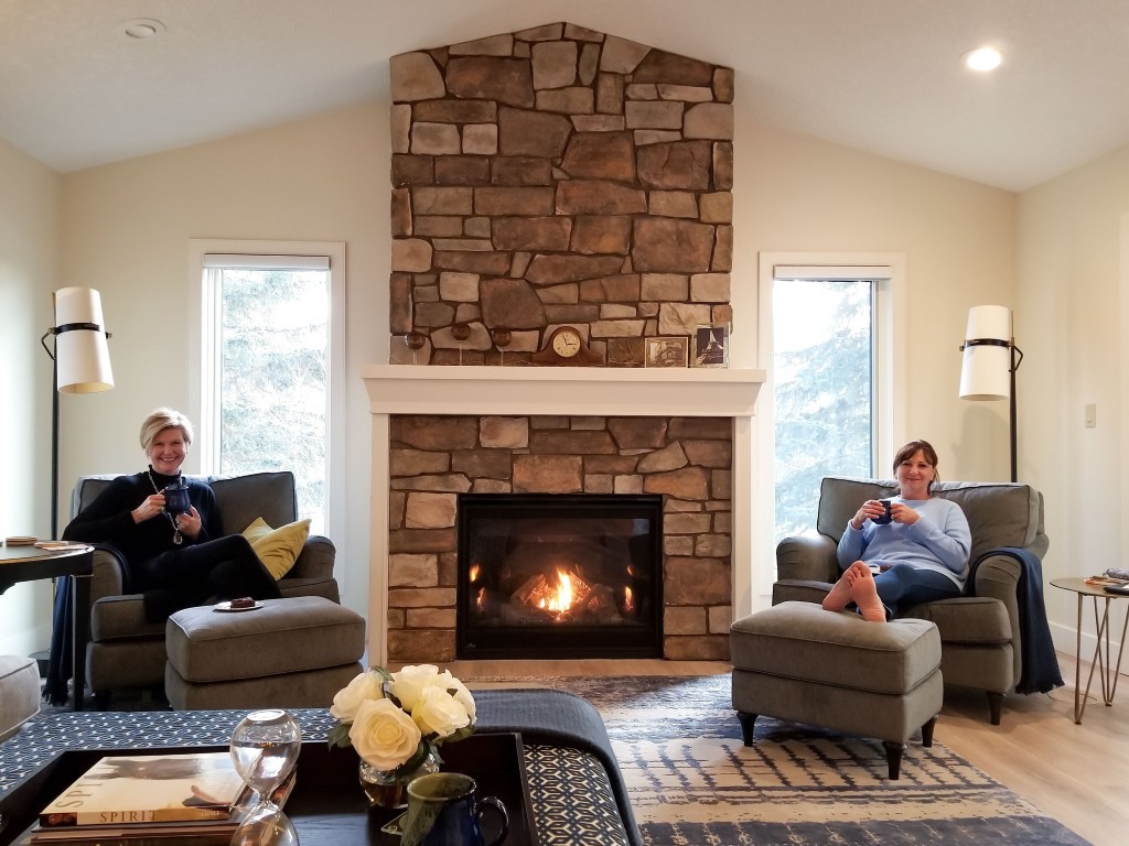 Image of Cozy living room with fireplace, comfortable seating, and modern interior design by KHD Homes.