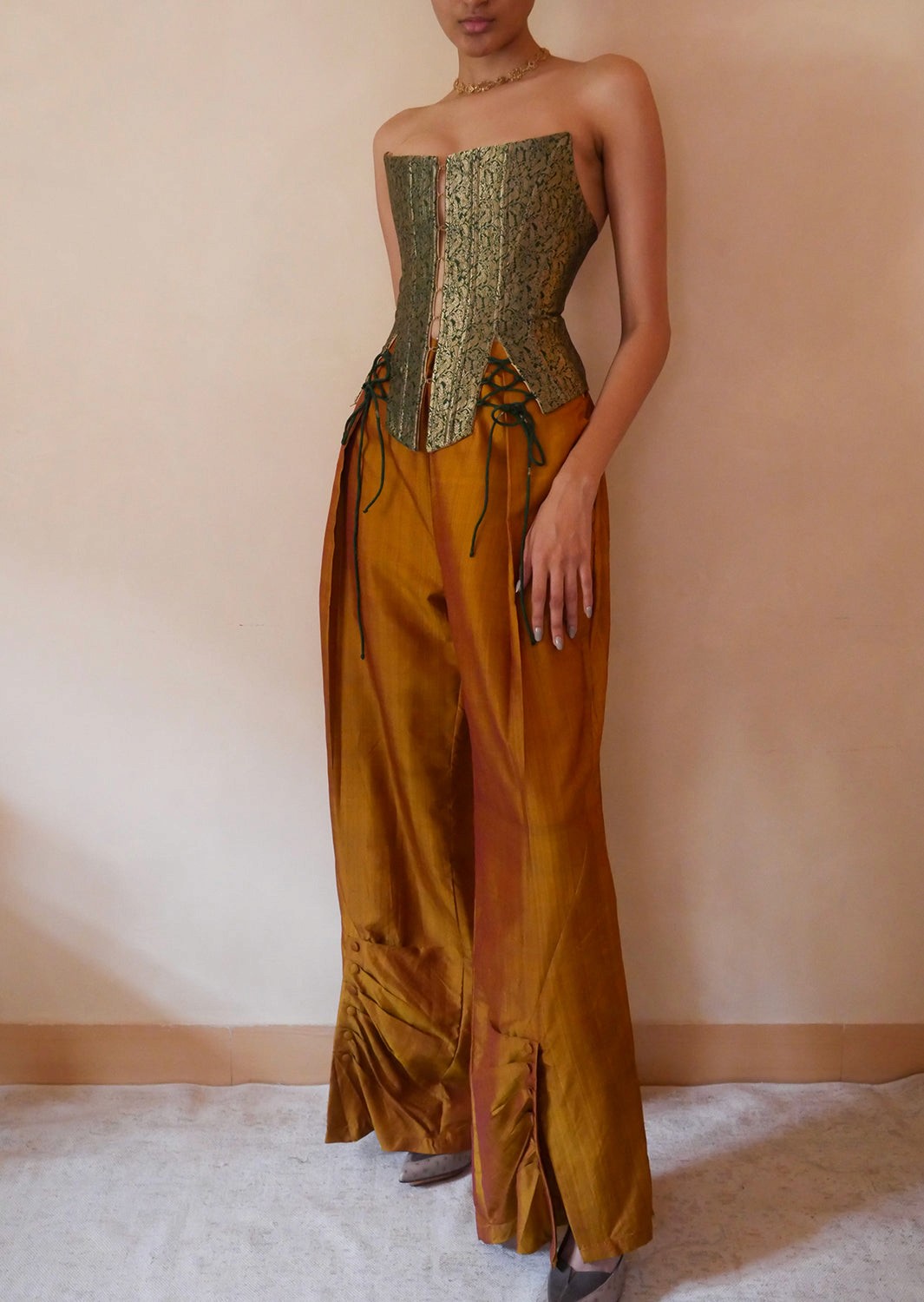 Raina is our one-of-a-kind four-panel corset, handcrafted in-house using a brocade silk saree.