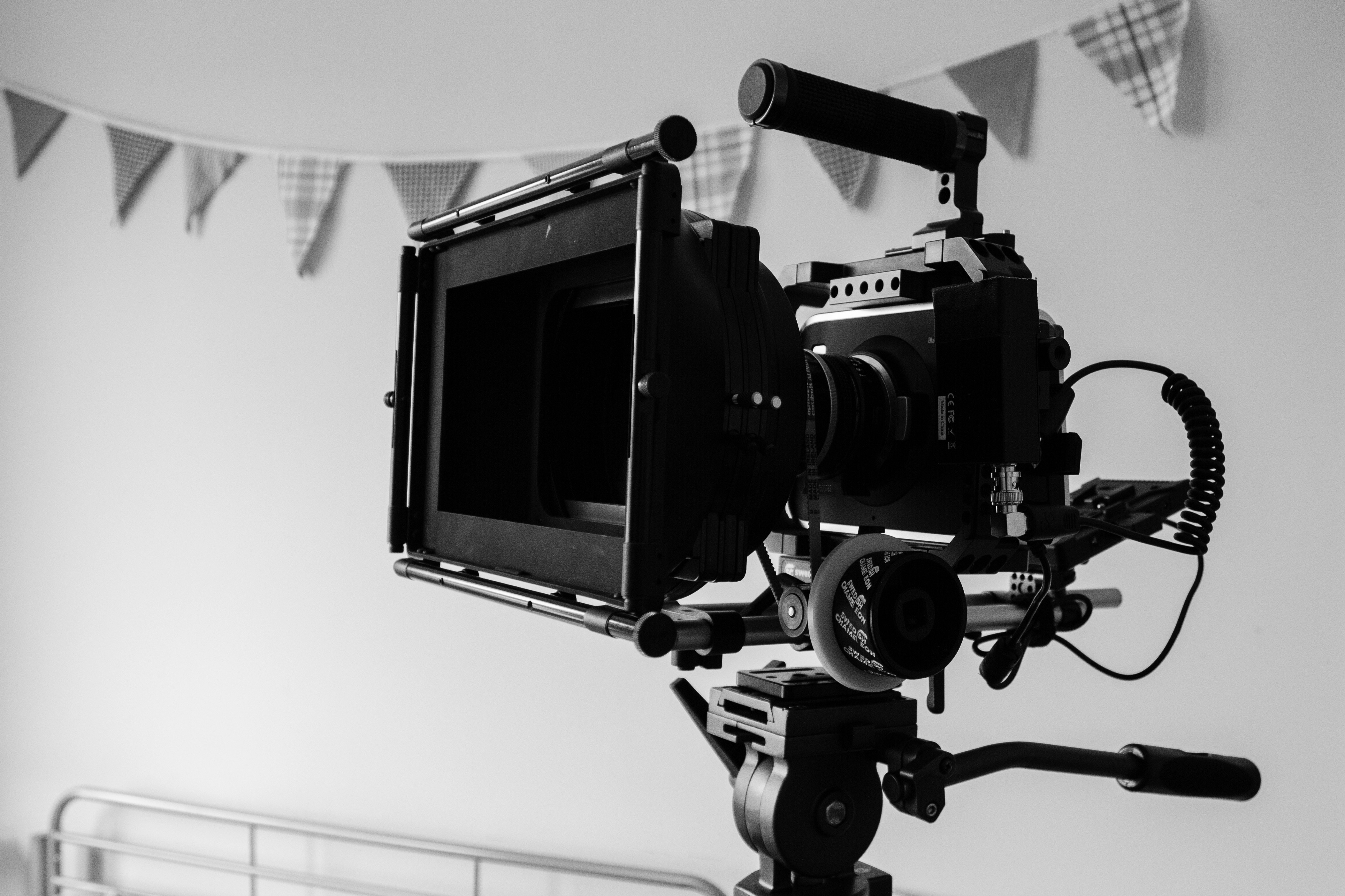black camera on white wall