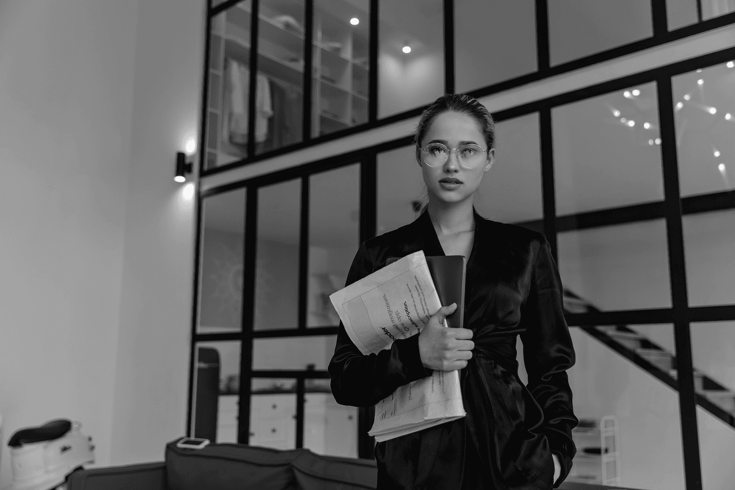 Black and white image of a woman looking towards the left side