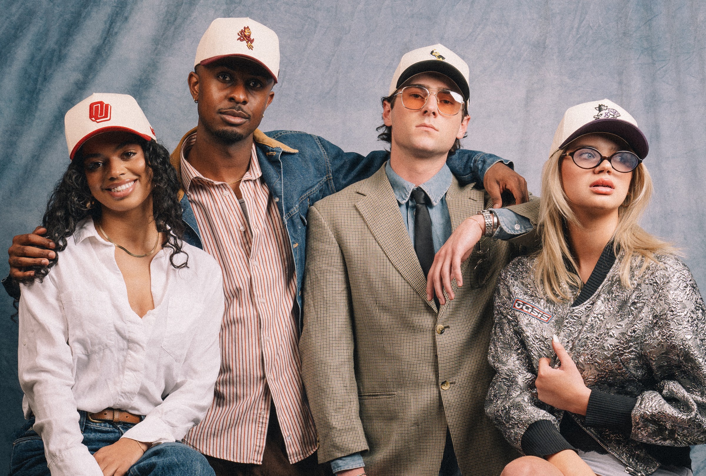 Streetside billboard with flyposters of the Batch.Works brand and illustrations