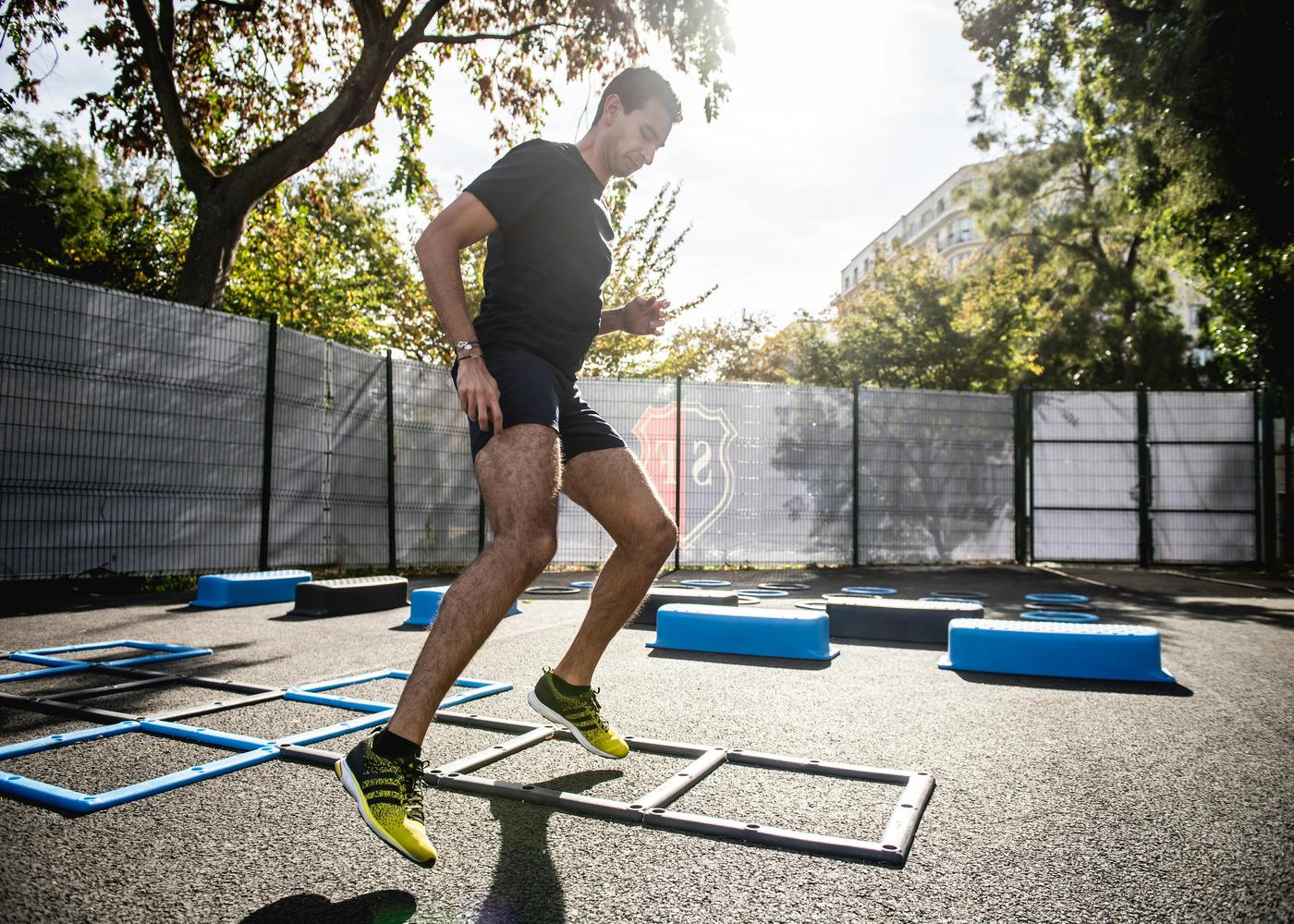 Man outdoors doing fitness exercises