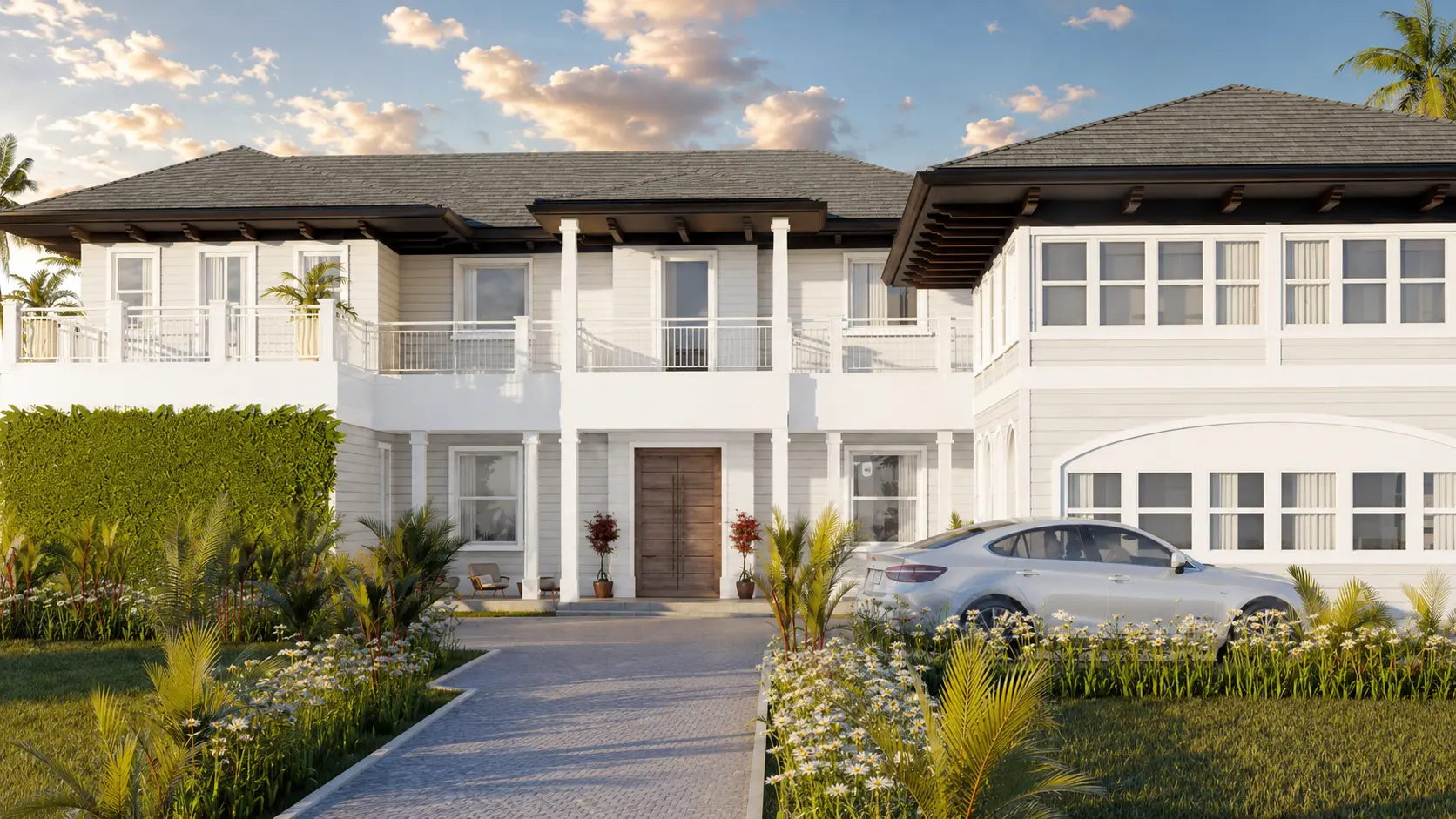 Front facade of a two-story British Colonial home in Coconut Grove with a wooden front door, paver driveway, tropical landscaping, and upper-level balcony.