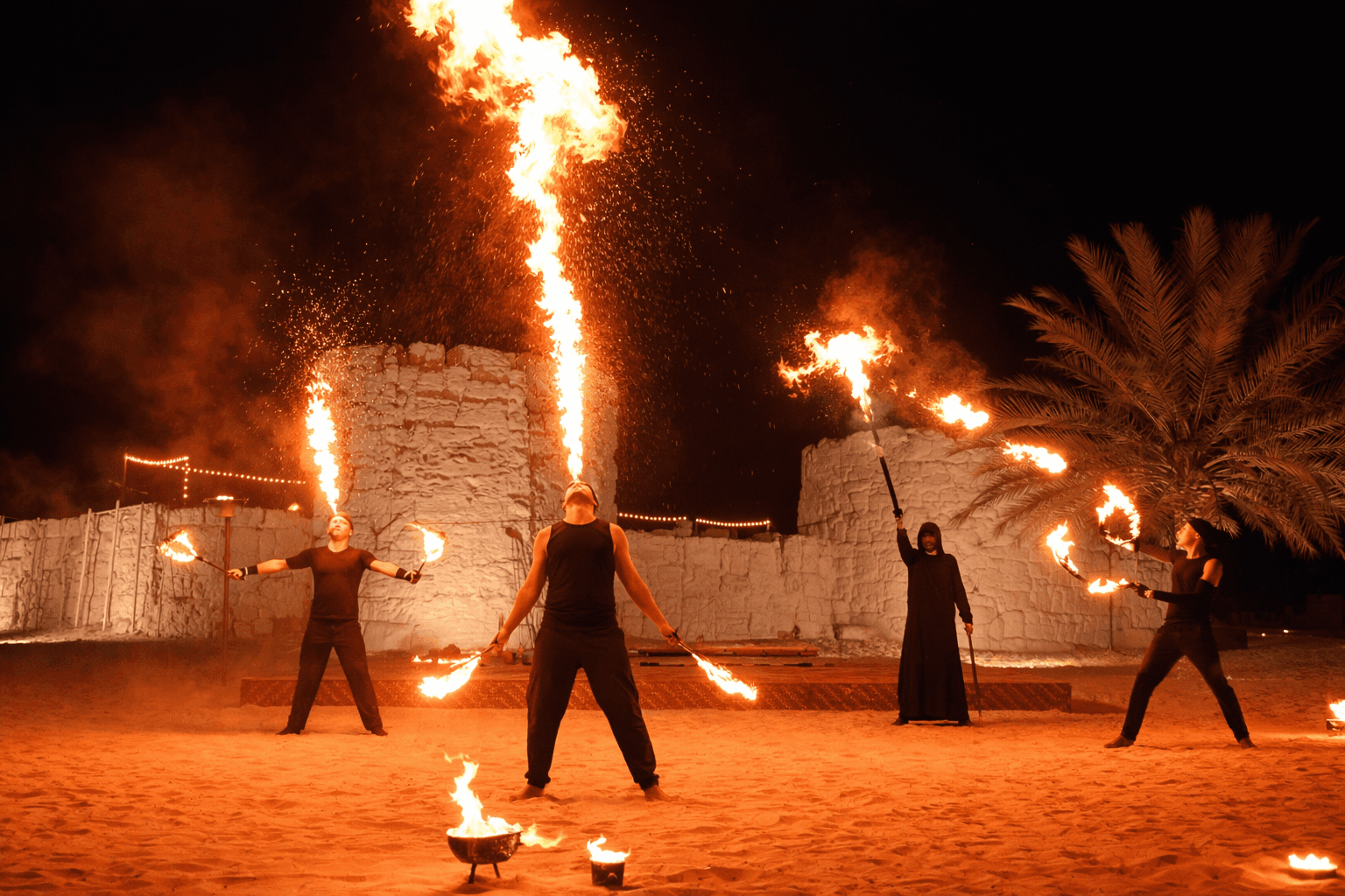 Fire show performance at The Fort Lisaili during the Dune Quest Tours VIP desert safari dinner show in Dubai