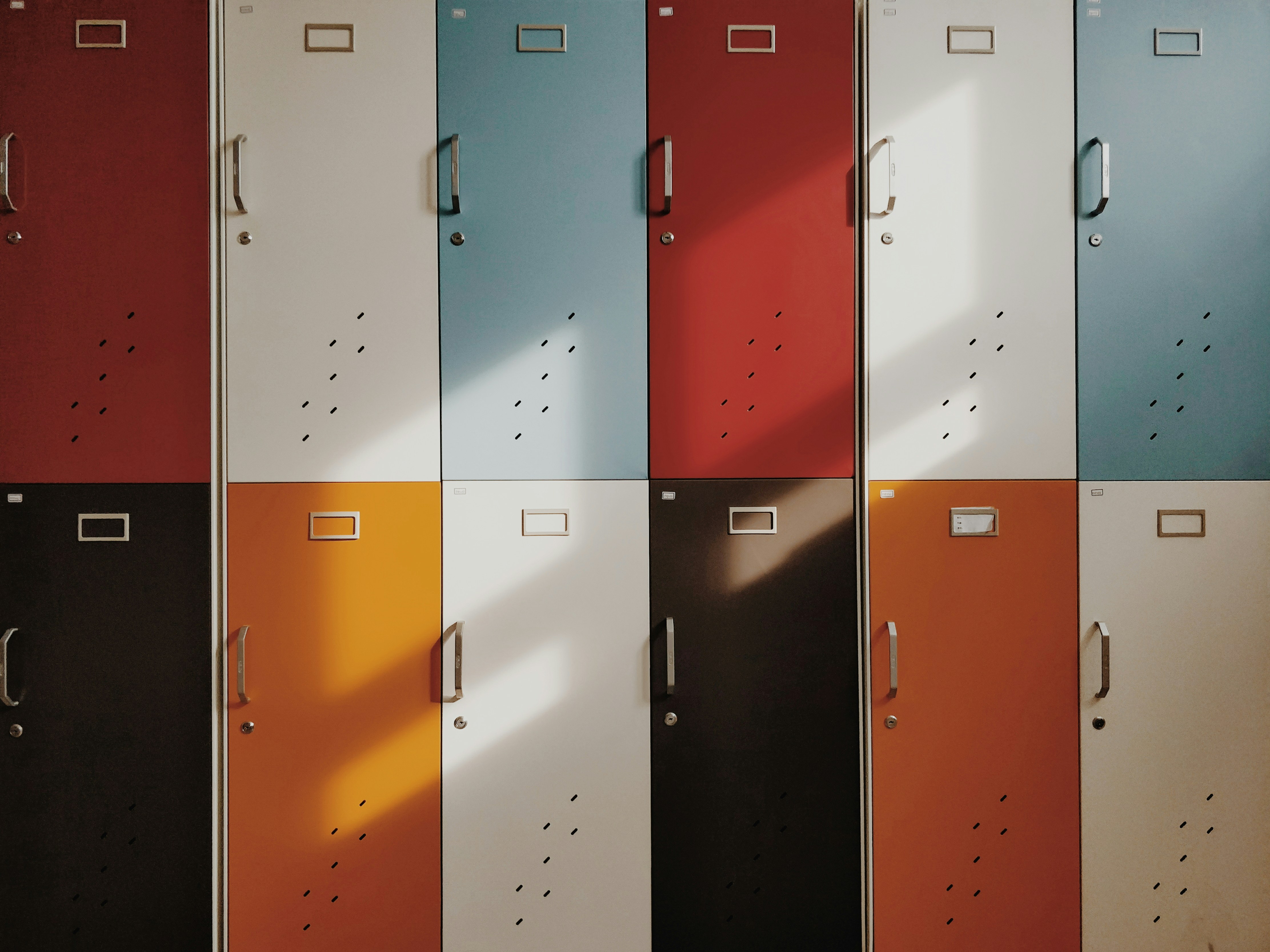 A row of lockers in a room, providing storage space for personal belongings and ensuring security.