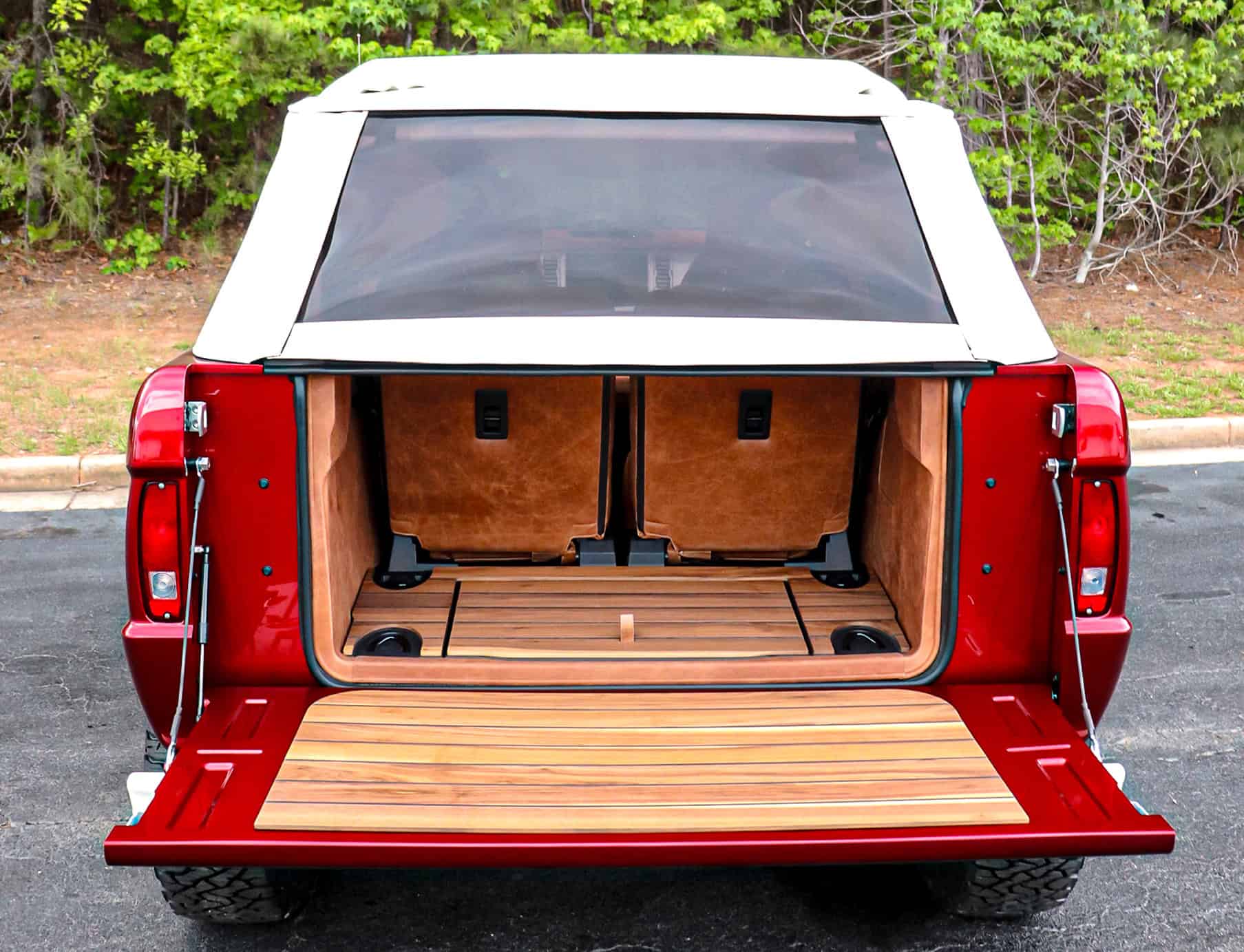 a person swimming in the water with grass