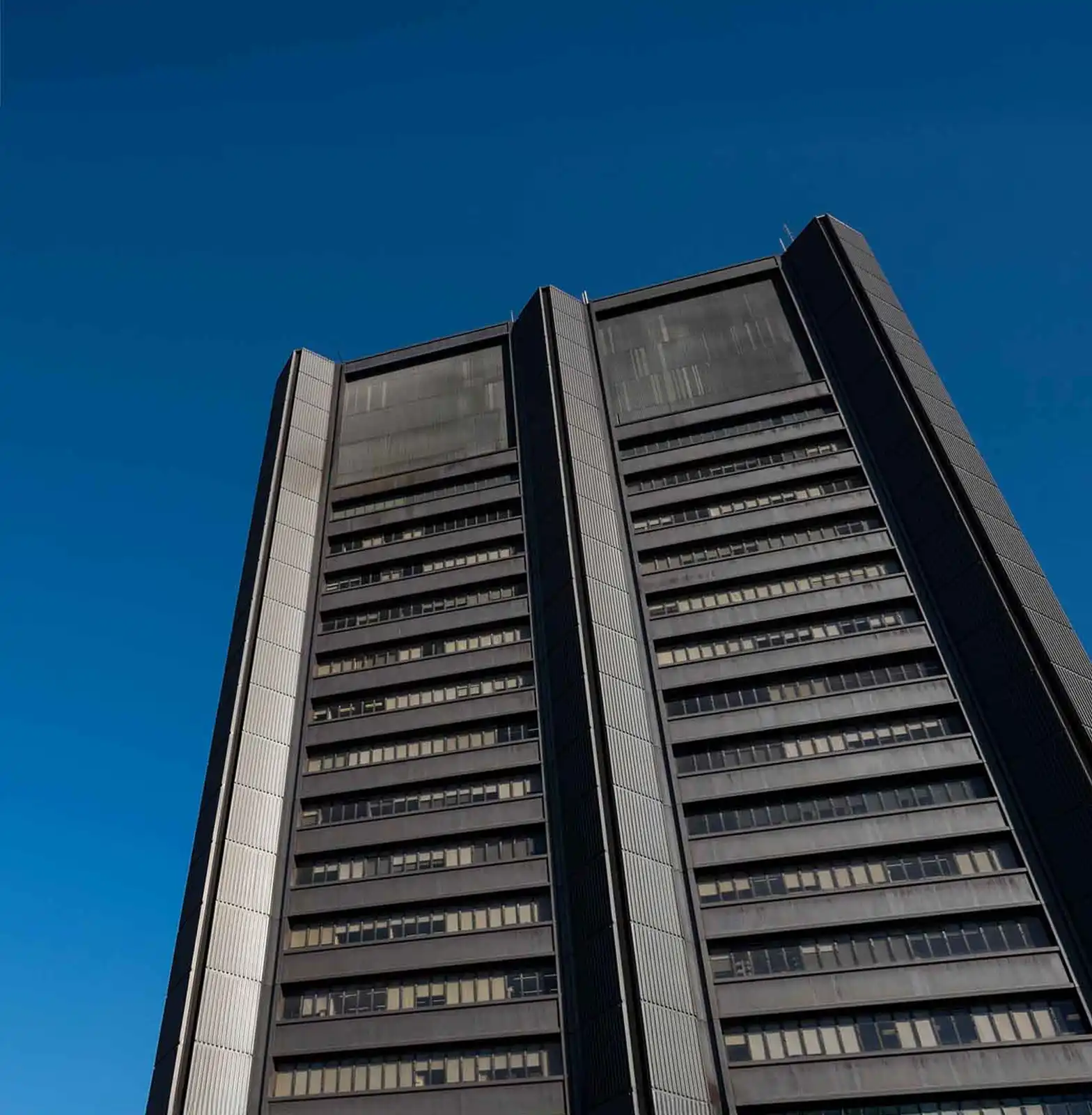 Hospital tower against a blue sky