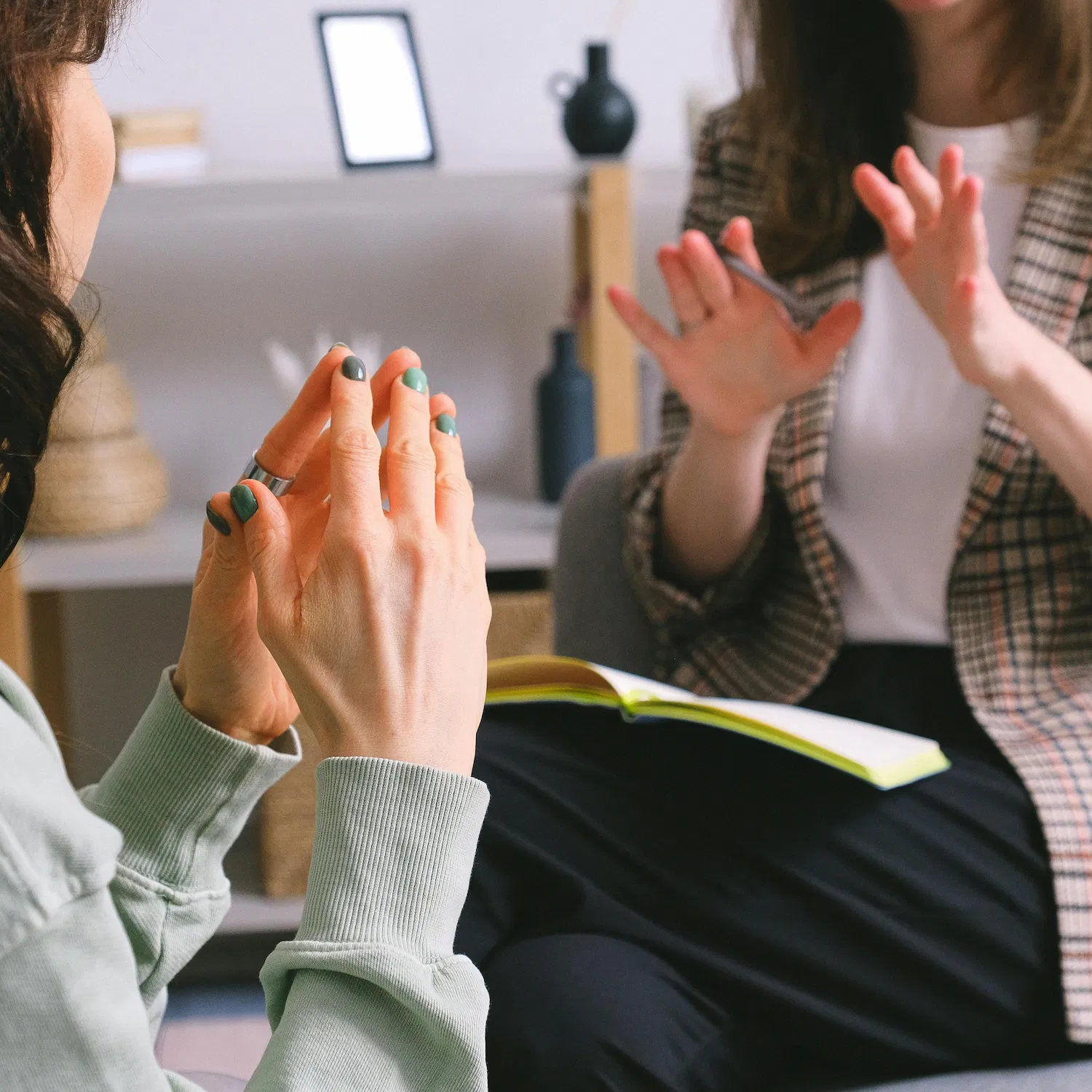Therapist and client in an LGBTQ codependency therapy session discussing relationship patterns and emotional boundaries in Los Angeles.