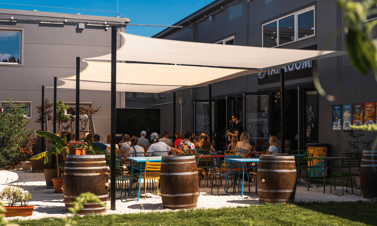 The team working together at a table with laptops, discussing business strategies or projects.