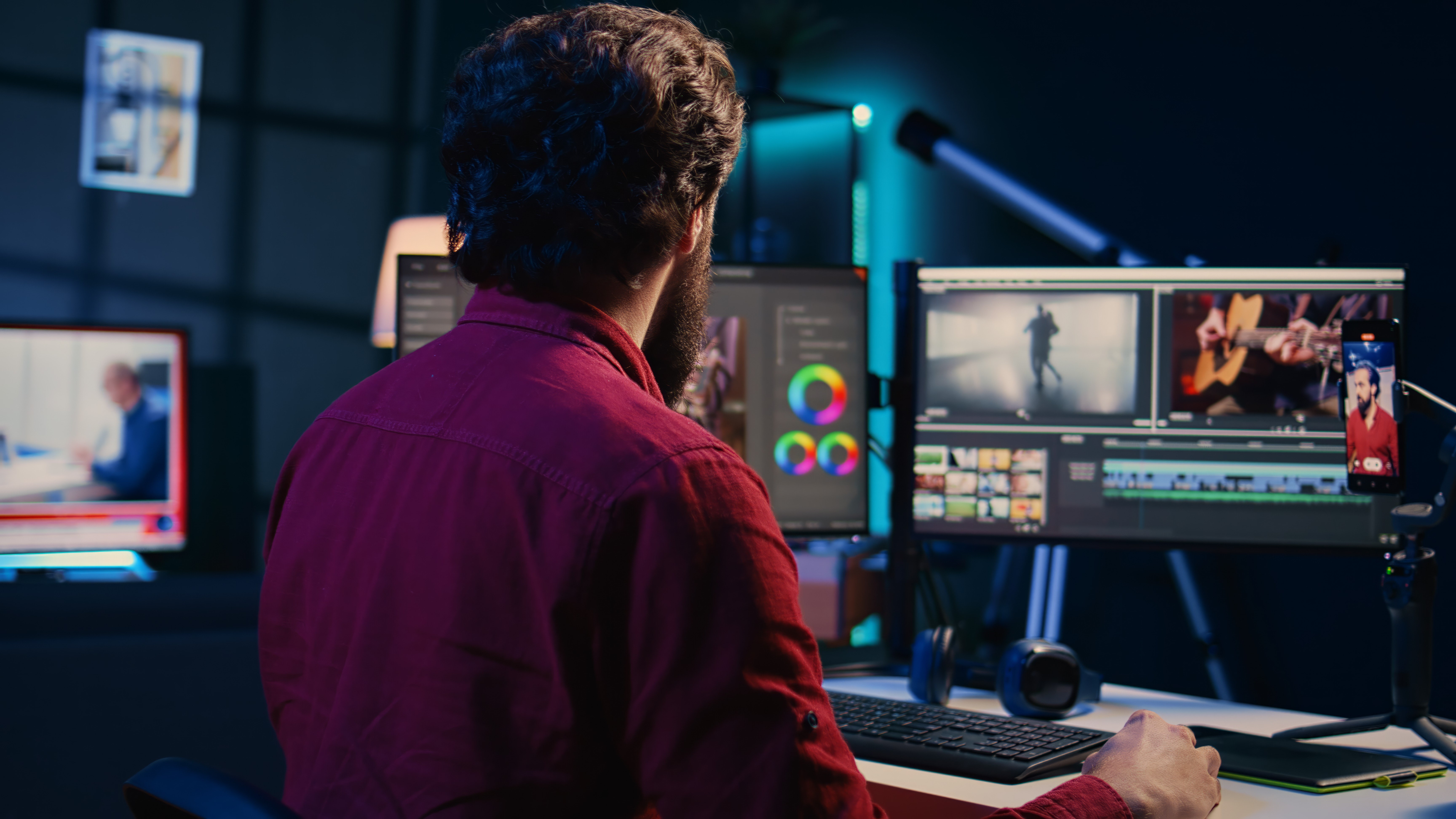 Man video editing in a office