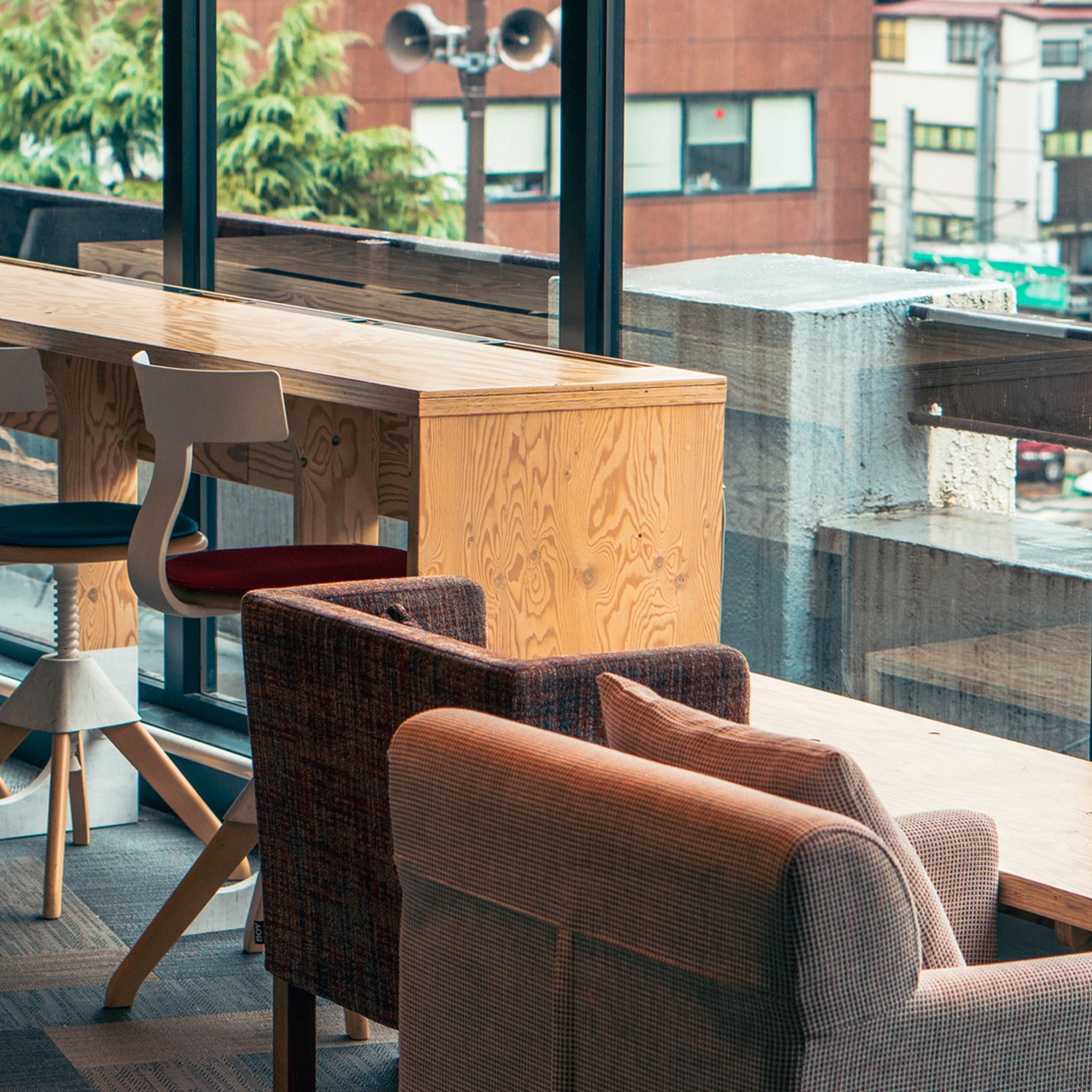 Interior of a cafe or workspace with several people at tables