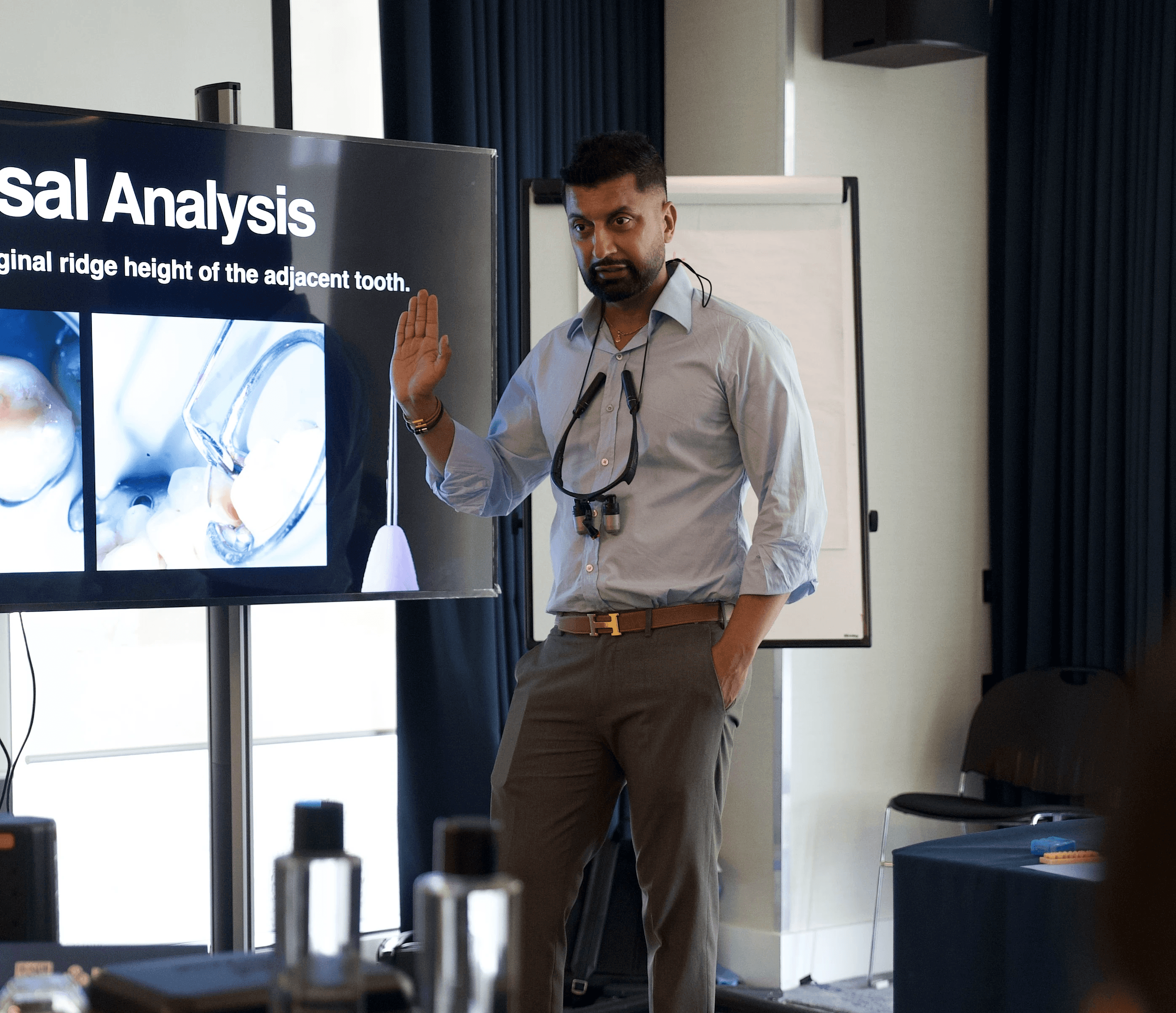 Dr Kunal Rai presenting at a dental education event