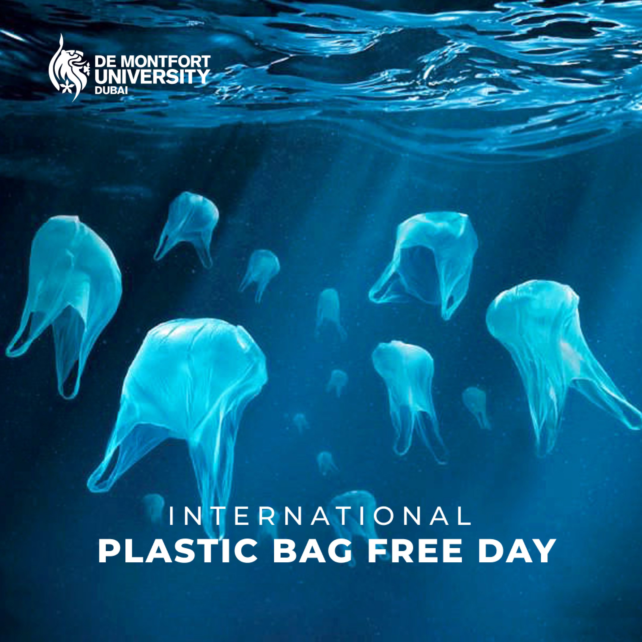 Jellyfish swimming underwater with text promoting International Plastic Bag Free Day for De Montfort University Dubai.