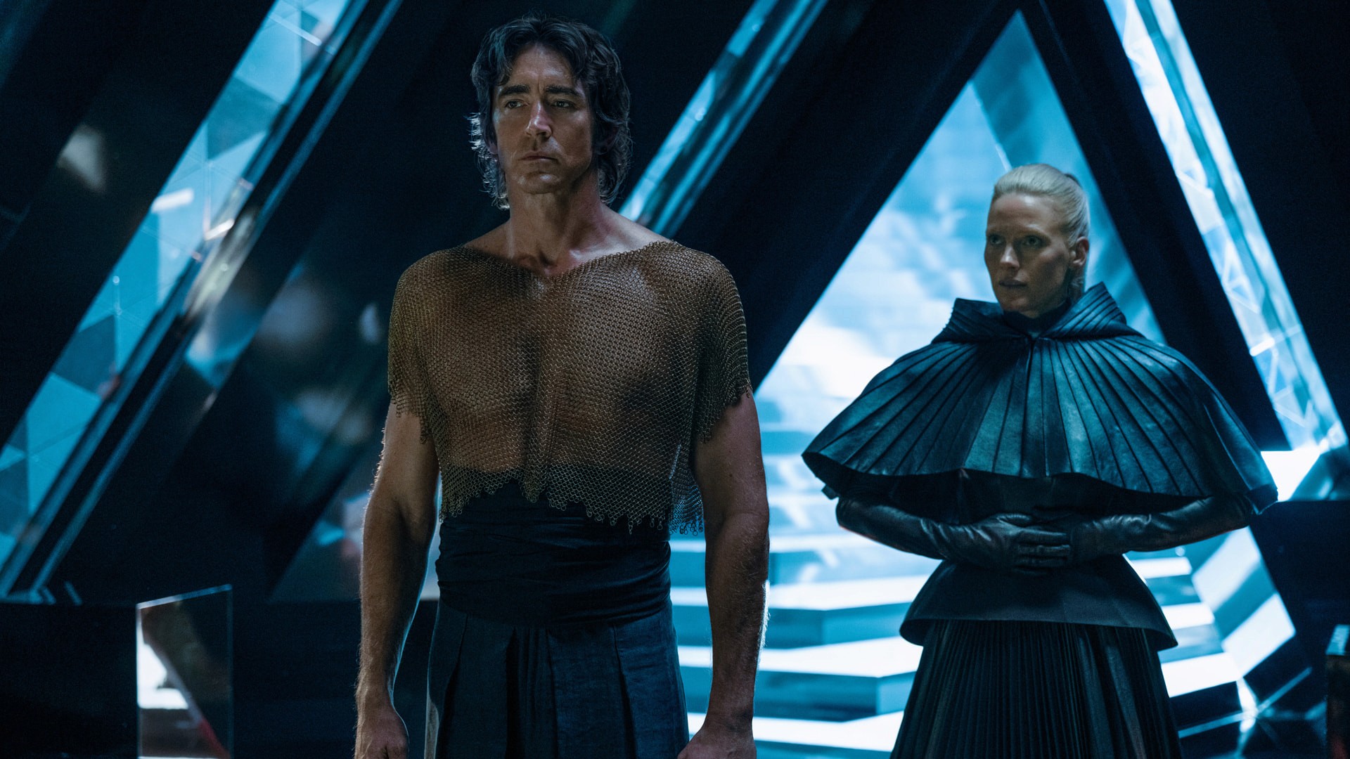 Set image of Lee Pace and Laura Birn in fututristic chamber from the show "Foundation