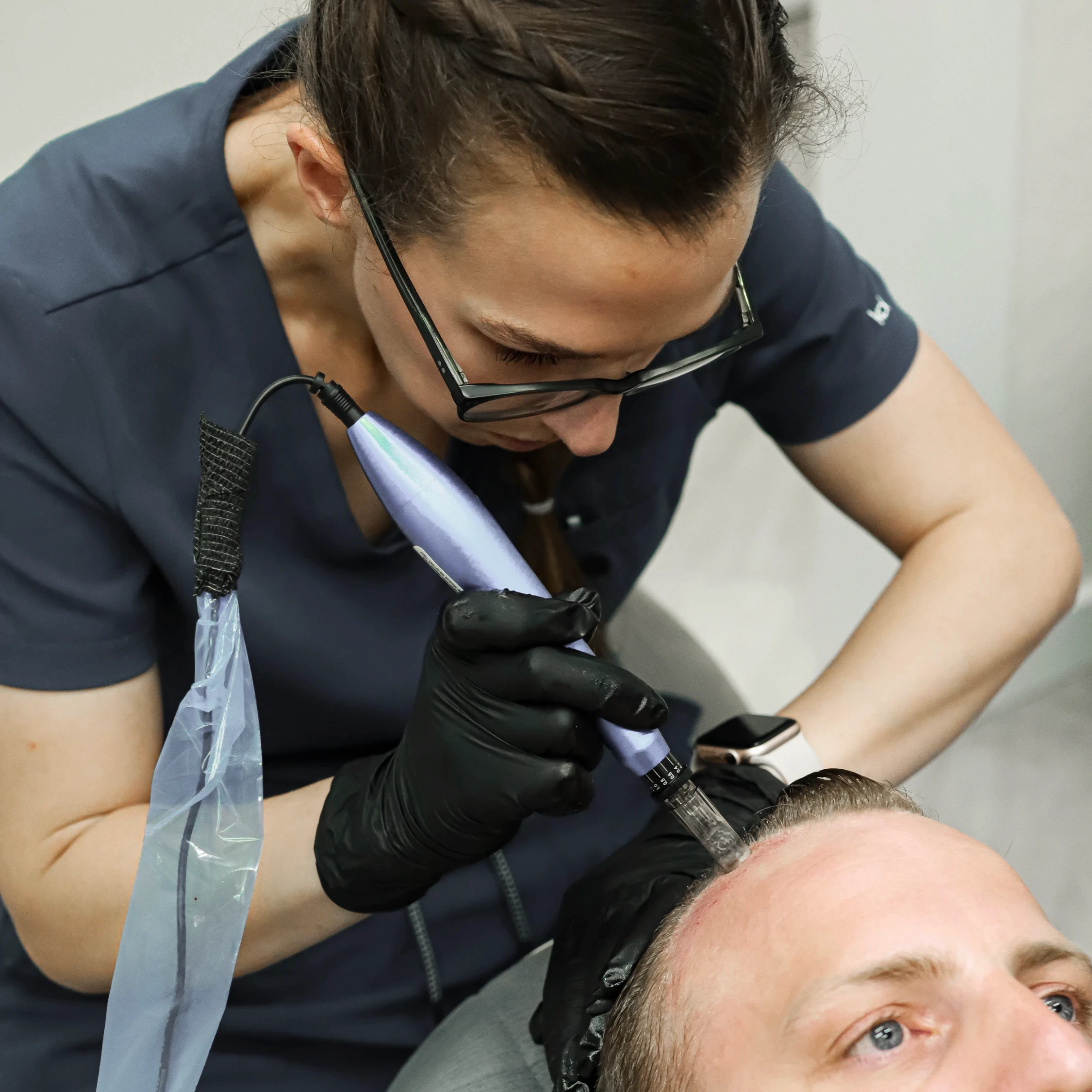 Chelsey Galipeau performing micro needling on a patient