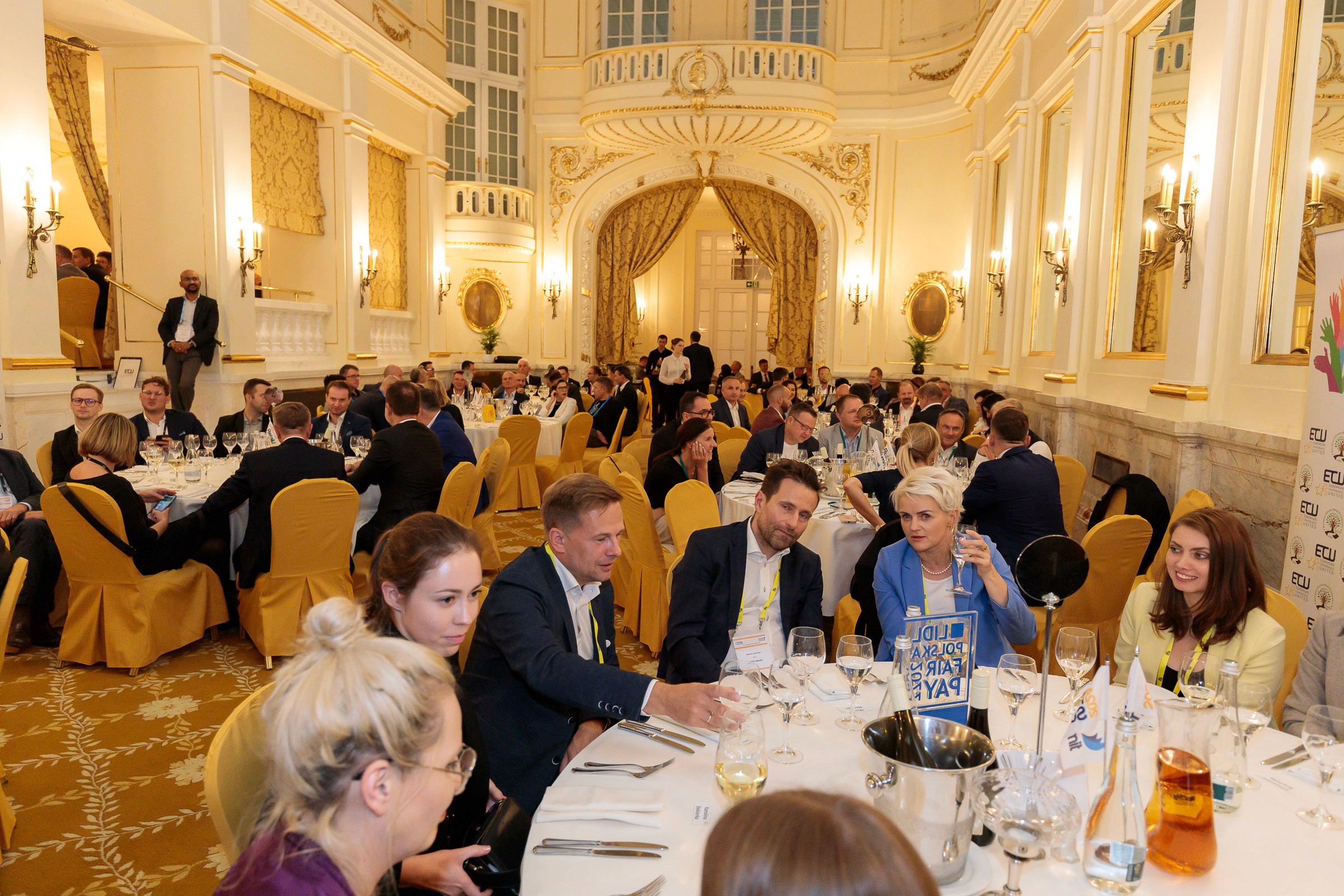 Colleagues talking at a dinner gathering