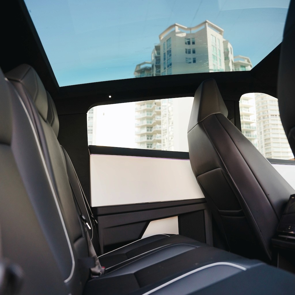 Rear seating area inside the Tesla Cybertruck Cyberbeast, featuring minimalist design and glass roof.
