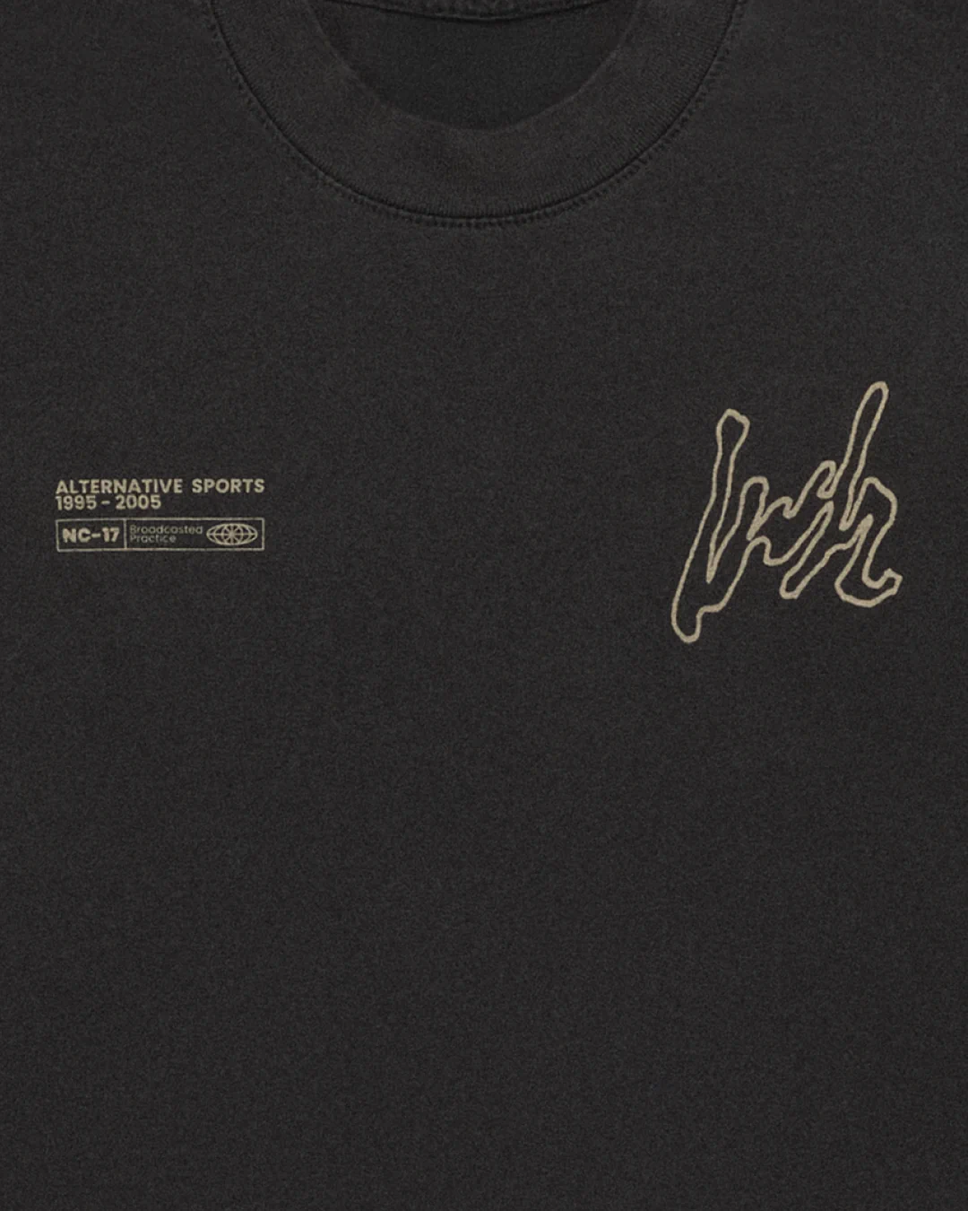 Close-up of the grey Alternative Sports T-Shirt featuring silkscreen print of the alternative LWH mark and advisory label in sesame.