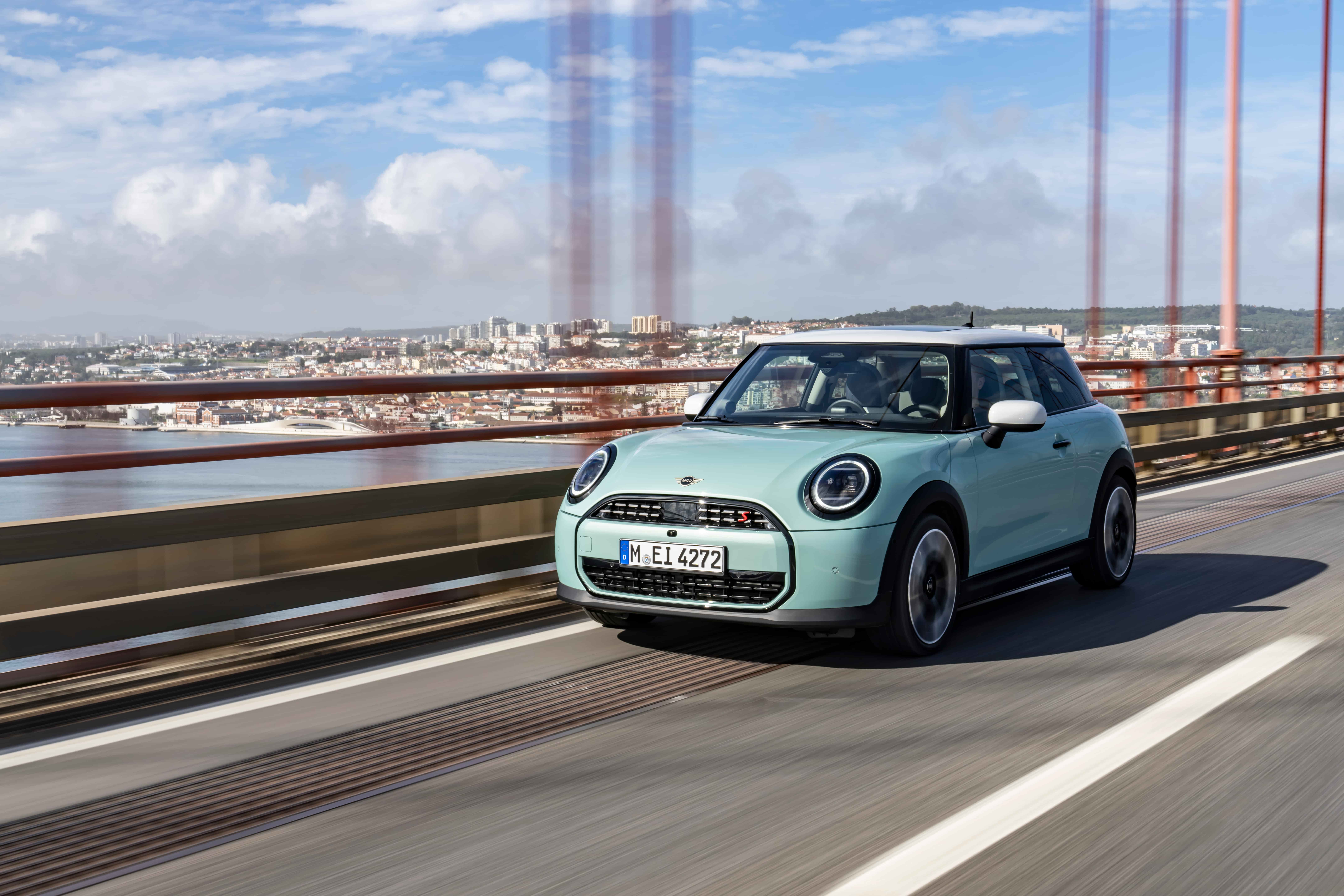 MINI Cooper S driving across a large suspension bridge in daylight