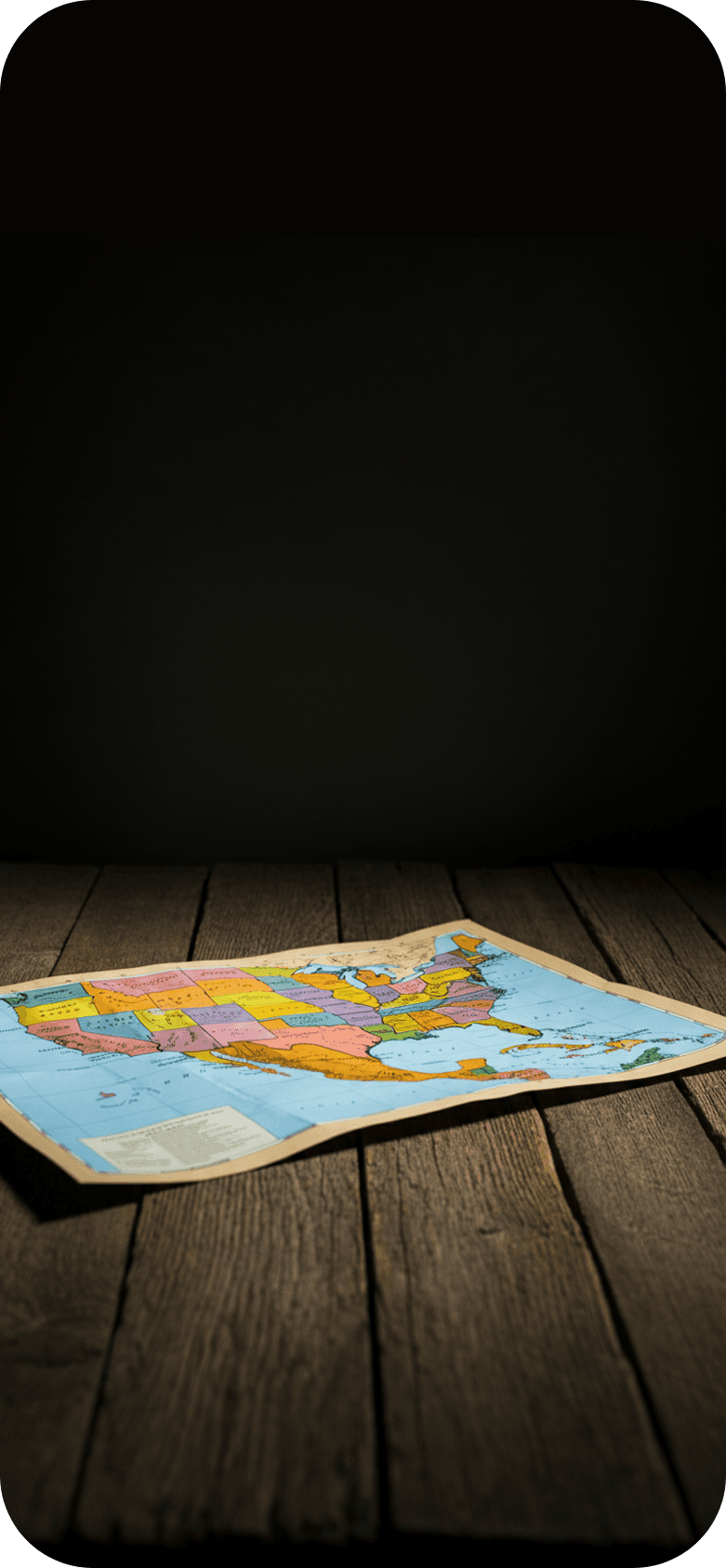 A map sitting on a wooden table