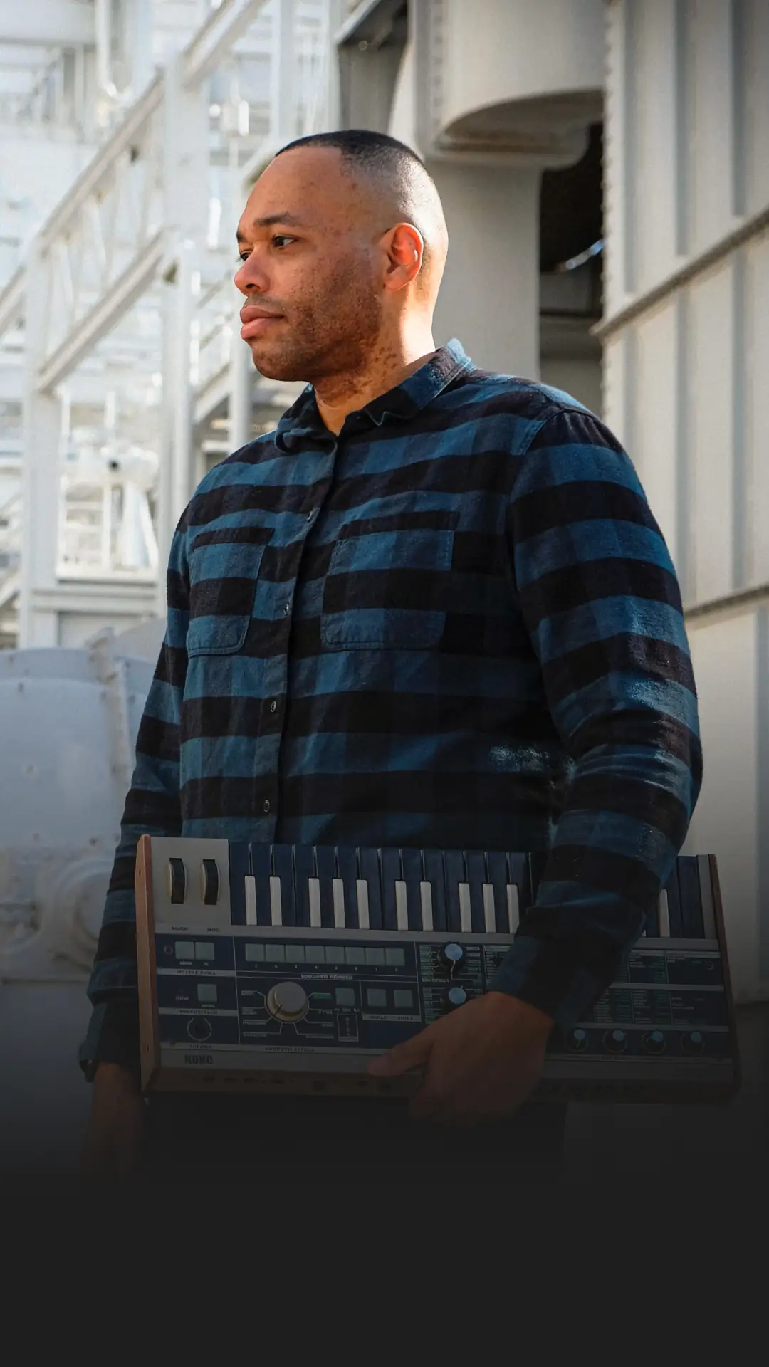 ARBZ — Hero photo of musician with synthesizer — Artist brand identity