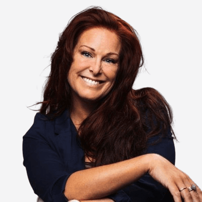 Headshot of employee, Shamini Dabare, on a blue tinted, grey background