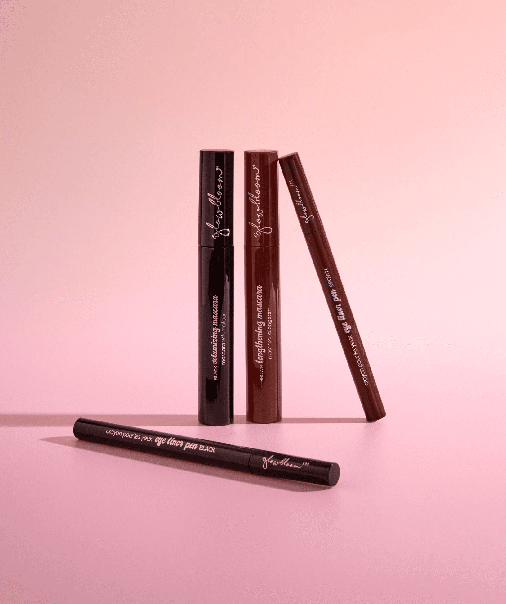 Close-up portrait of a woman with flawless skin wearing a wide-brimmed beige hat, her face softly framed by delicate shadows.