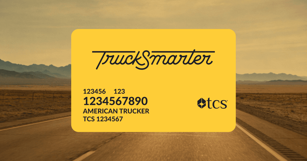 The TruckSmarter x TCS Fuel Card — a yellow card co-branded with TruckSmarter and TCS logos, shown against an open highway background.