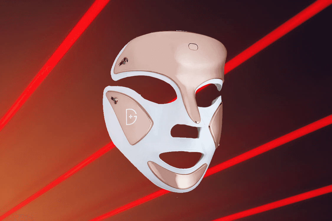 man filming on beach