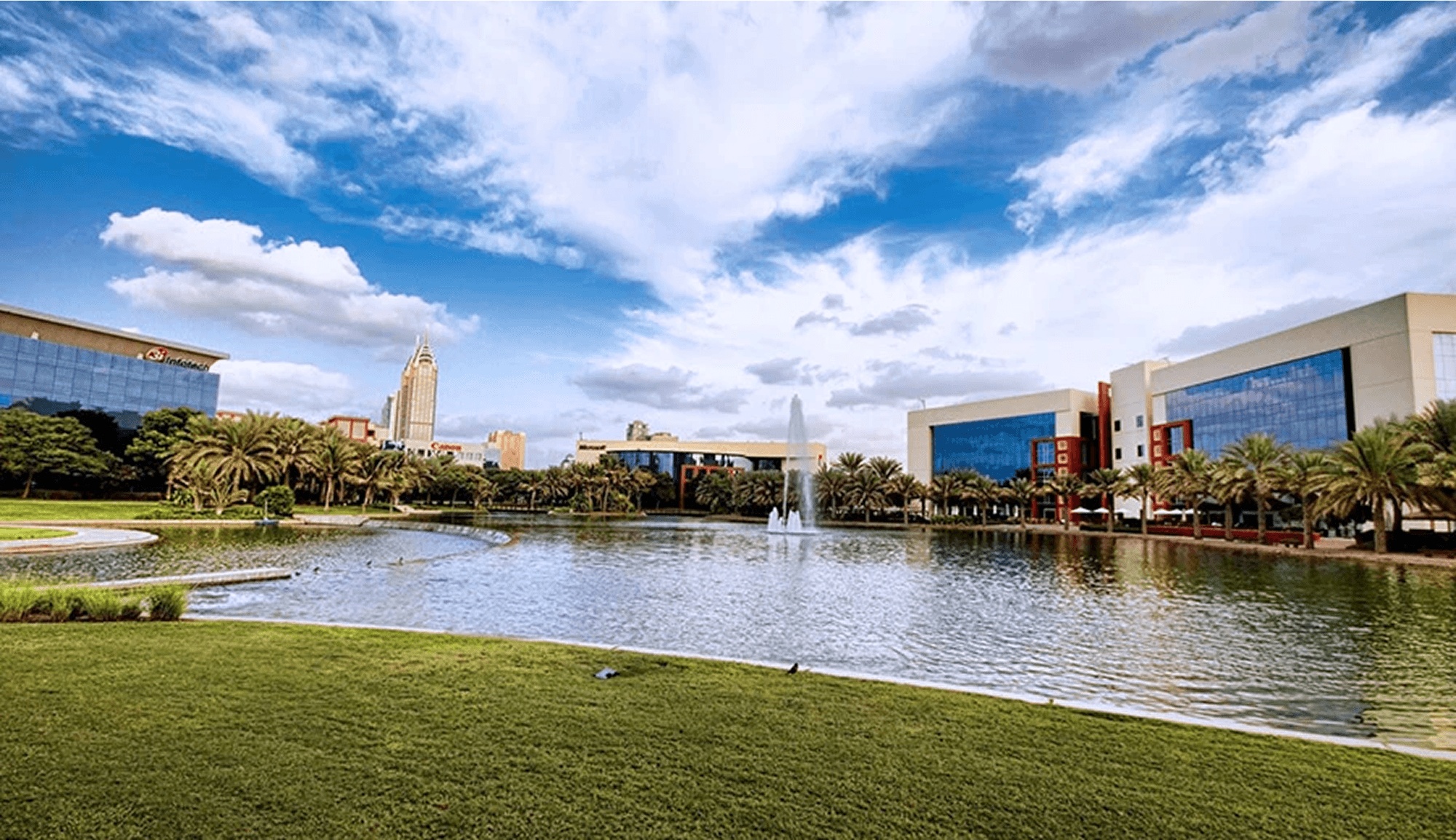 A scenic view of the Dubai Internet City with clear blue sky. 