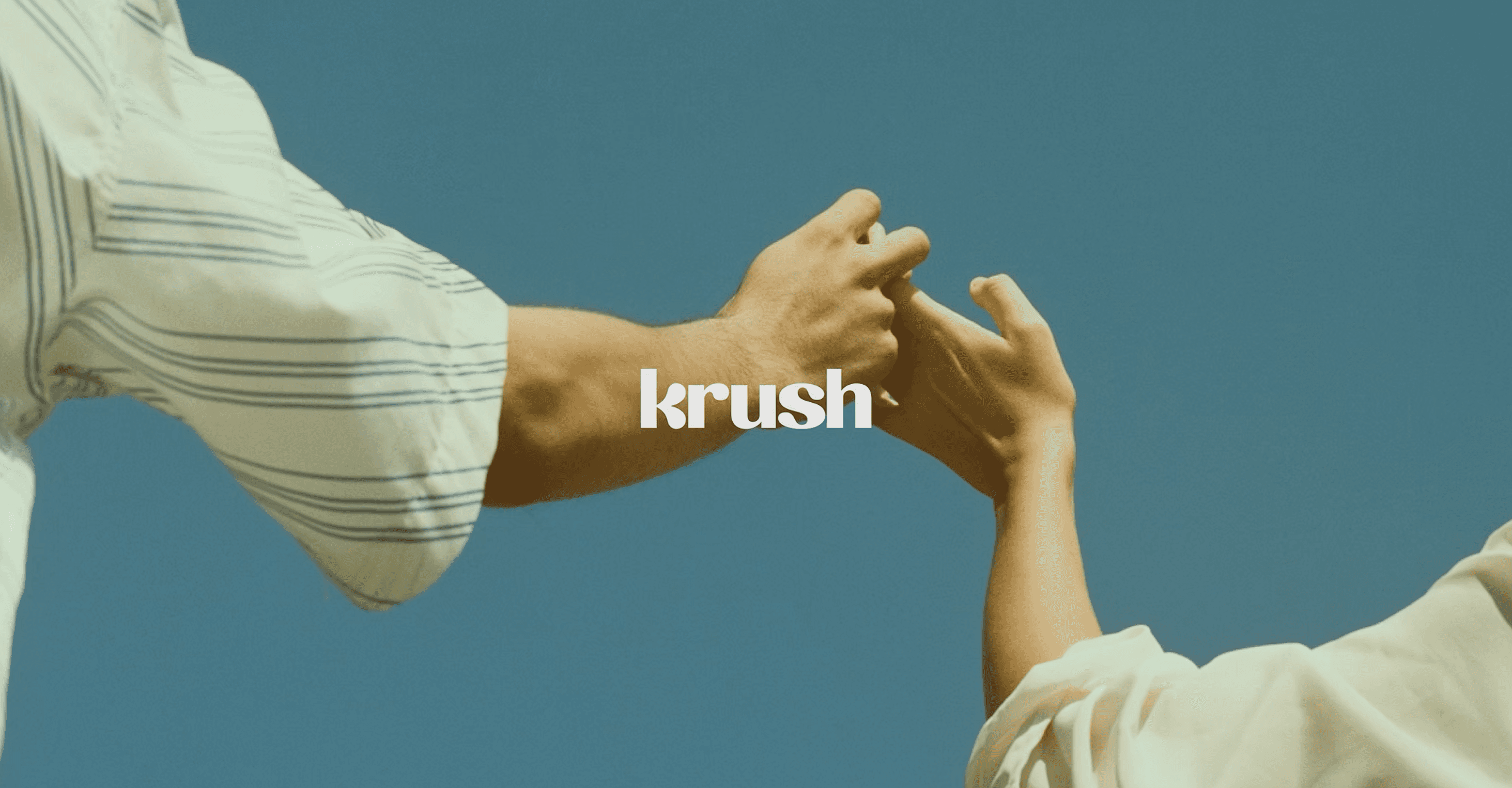 KRUSH brand image: three people seen from behind, arms around each other against a blue sky, with the lowercase KRUSH wordmark across the bottom in white.