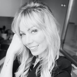 Woman with freckles and glossy lips