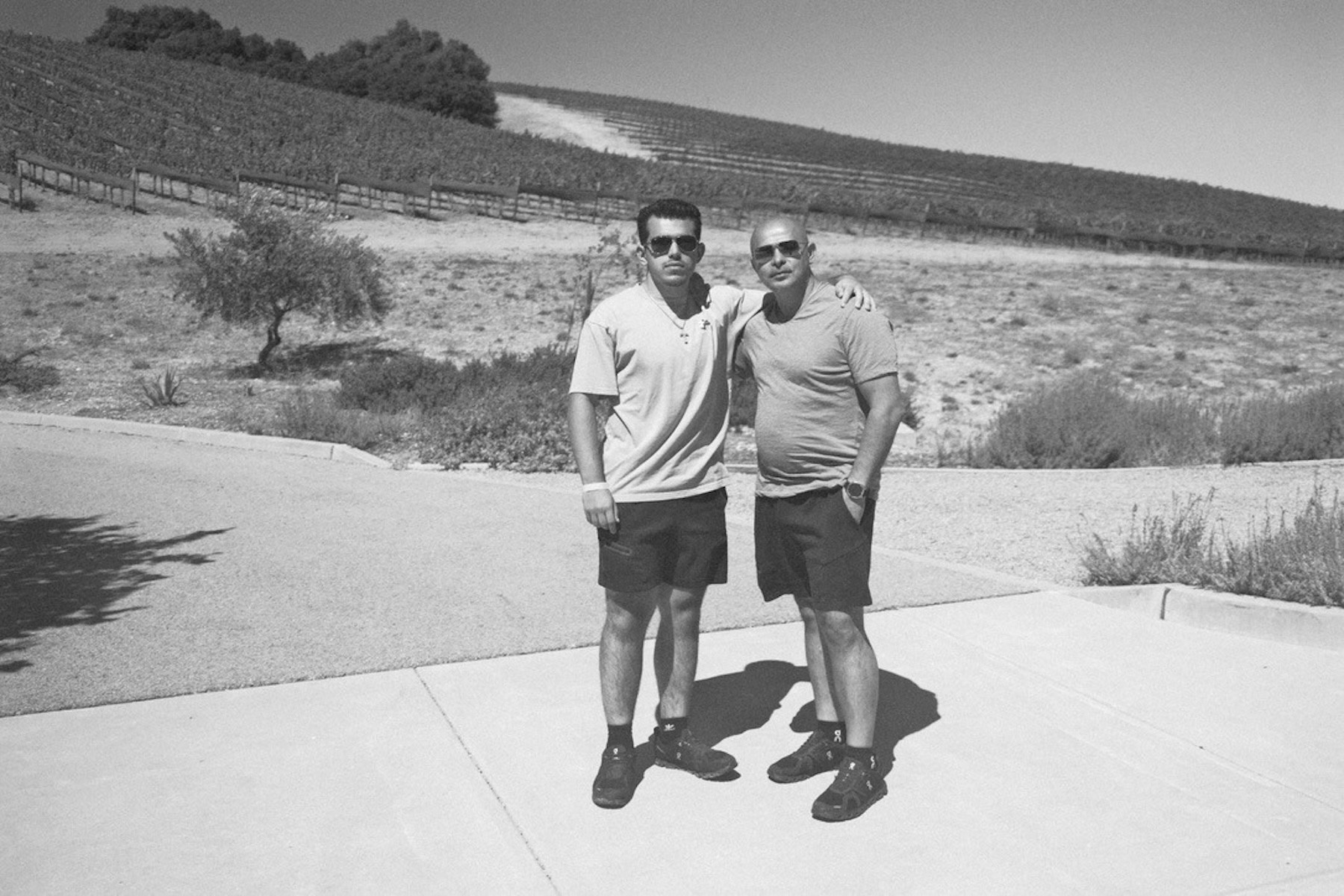 Matthew and Arthur Tovmasian standing together outdoors, founders of POLIVAULT.
