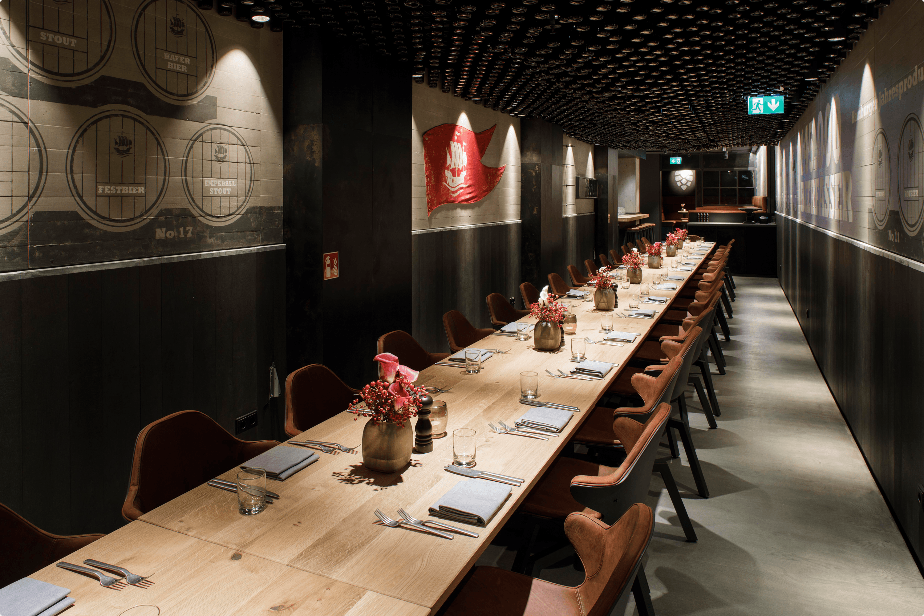 Long dining table set with chairs and floral arrangements