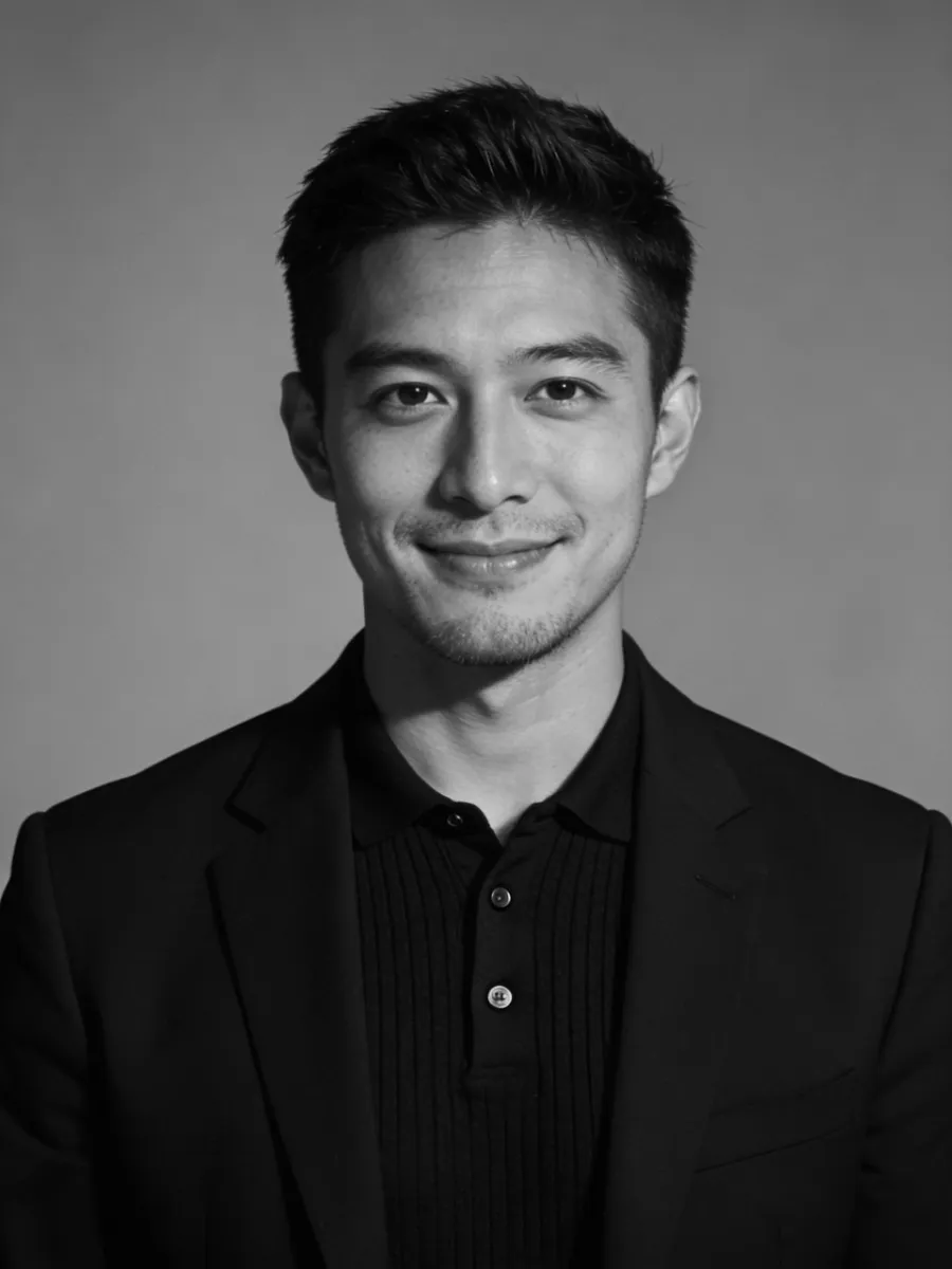 Professional portrait of young man in a black suit